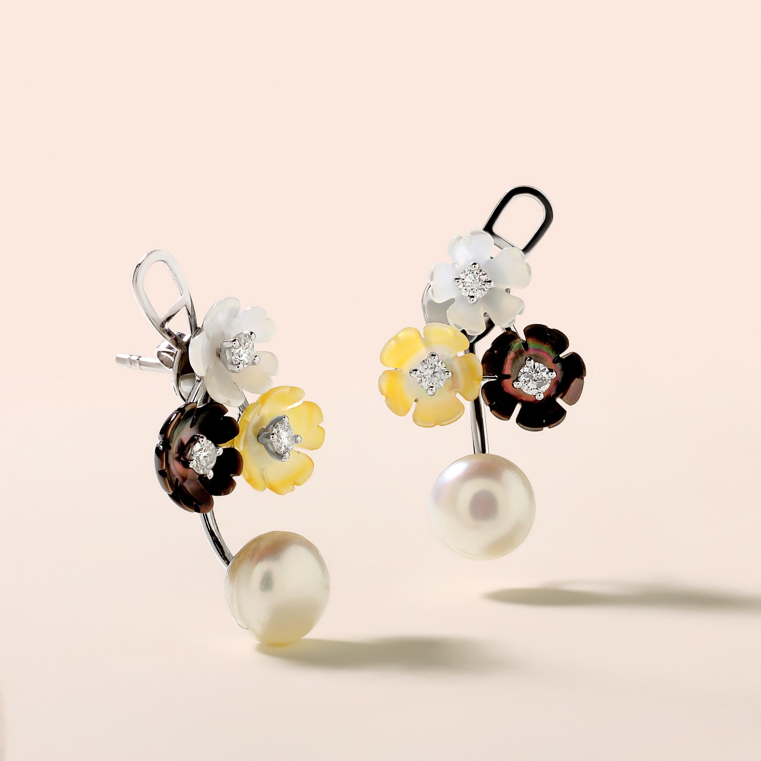 Crafted in 5.54 grams of 14K White Gold, the earrings contains 6 stones of Round Diamonds with a total of 0.37 carat in F-G color and I1-I2 clarity combined with 6 stones of Cultured Pearls with a total of 9.75 carat.

CONTEMPORARY AND TIMELESS