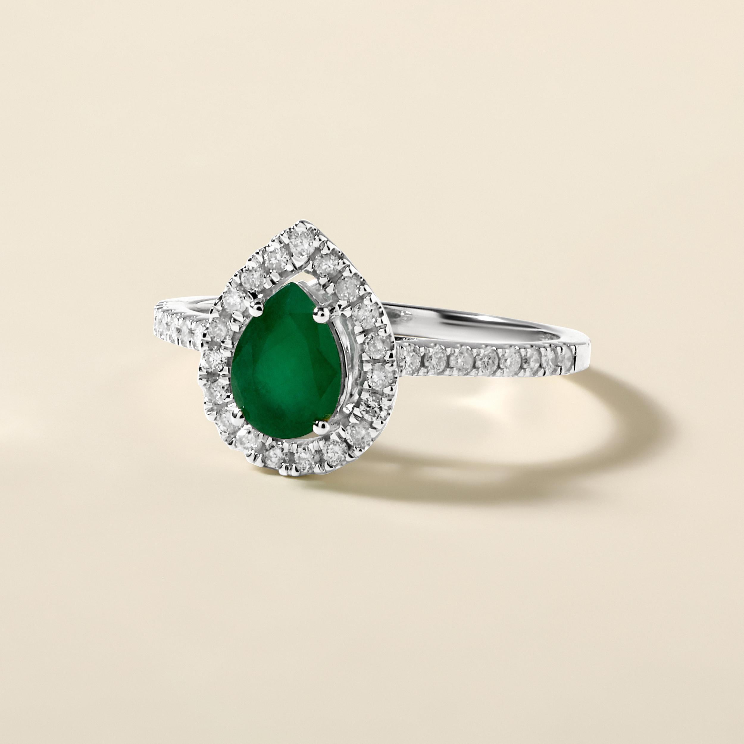 Ring Size: US 7

Crafted in 2.5 grams of 14K White Gold, the ring contains 35 stones of Round Natural Diamonds with a total of 0.28 carat in G-H color and I1-I2 clarity combined with 1 stone of Pear Shaped Natural Emerald Gemstone with a total of