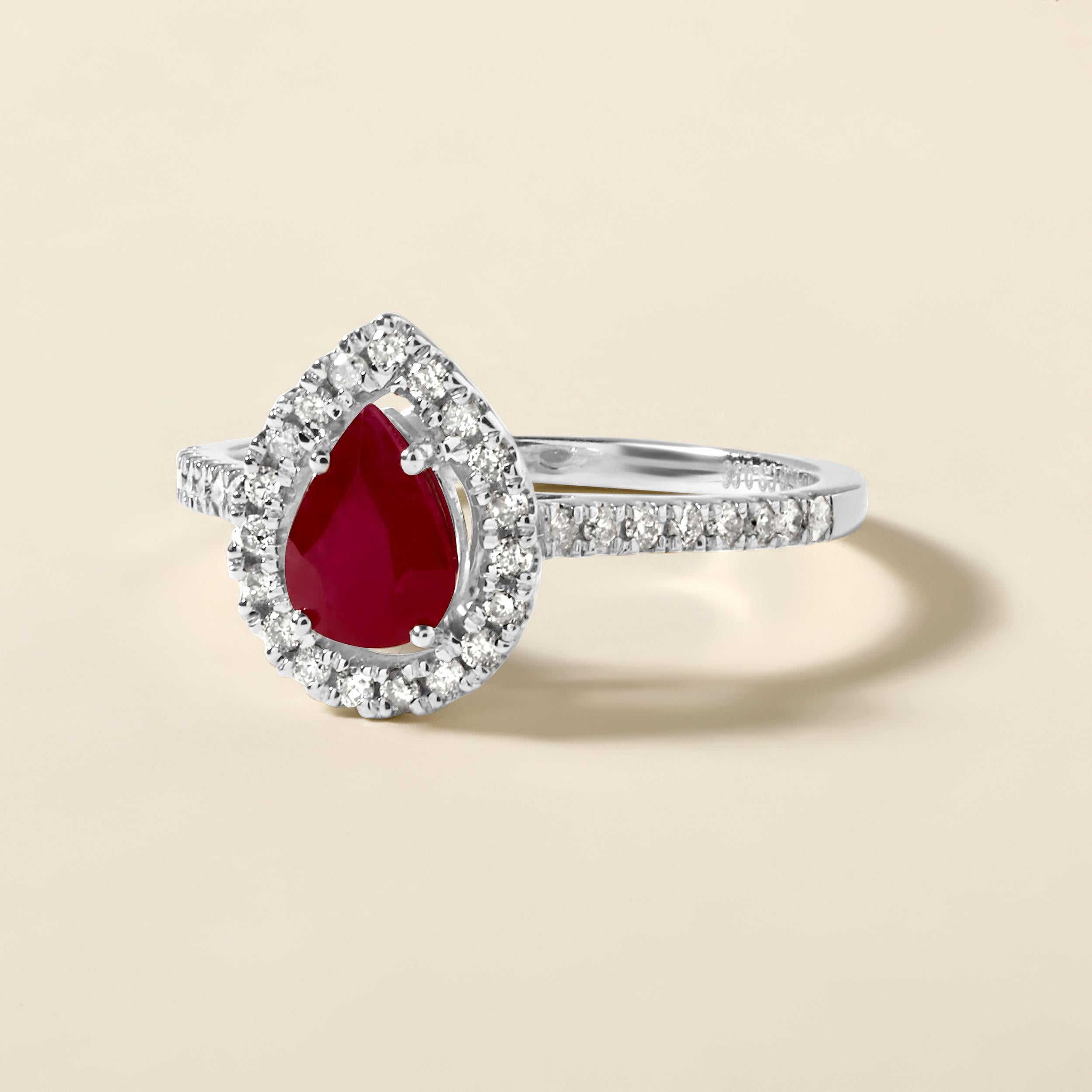 Ring Size: US 7

Crafted in 2.47 grams of 14K White Gold, the ring contains 35 stones of Round Natural Diamonds with a total of 0.28 carat in G-H color and I1-I2 clarity combined with 1 stone of Pear Shaped Natural Ruby Gemstone with a total of 0.96