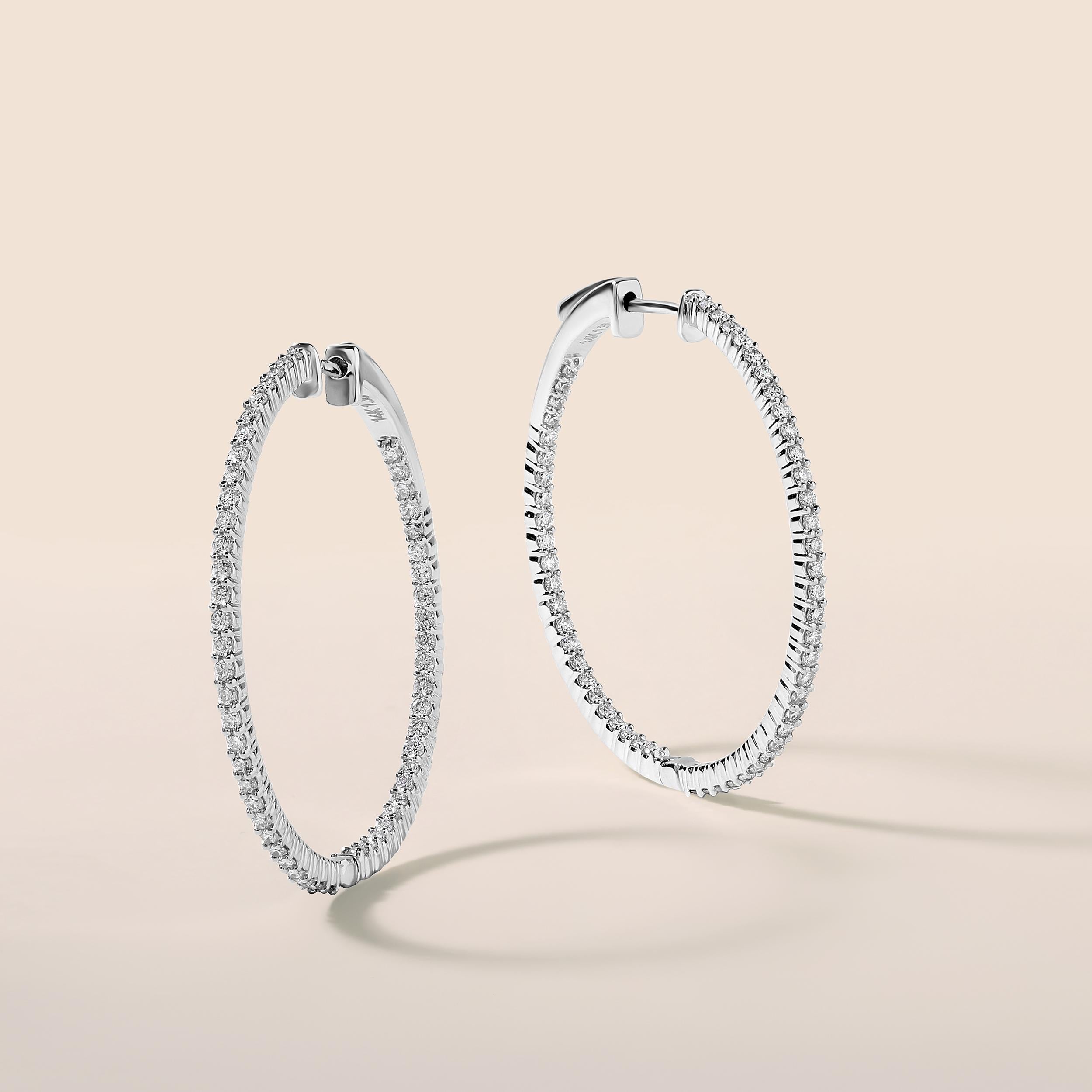 Crafted in 8.39 grams of 14K White Gold, the earrings contains 108 stones of Round Diamonds with a total of 1.36 carat in G-H color and SI clarity.

CONTEMPORARY AND TIMELESS ESSENCE: Crafted in 14-karat/18-karat with 100% natural diamond and