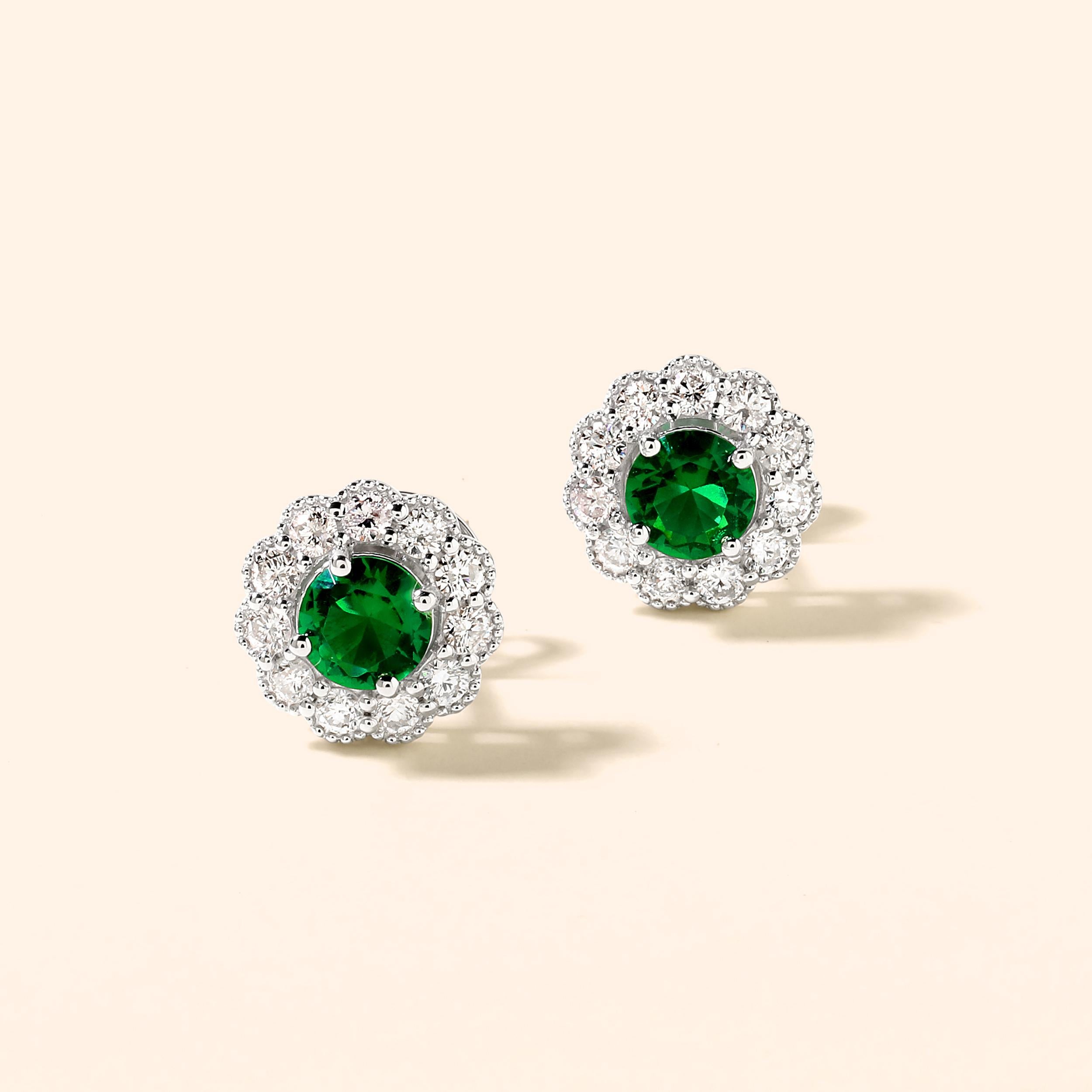 Crafted in 3.35 grams of 14K White Gold, the earrings contains 22 stones of Round Diamonds with a total of 0.62 carat in F-G color and I1-I2 clarity combined with 2 stones of Lab Created Emerald Gemstone with a total of 0.74 carat.

This jewelry