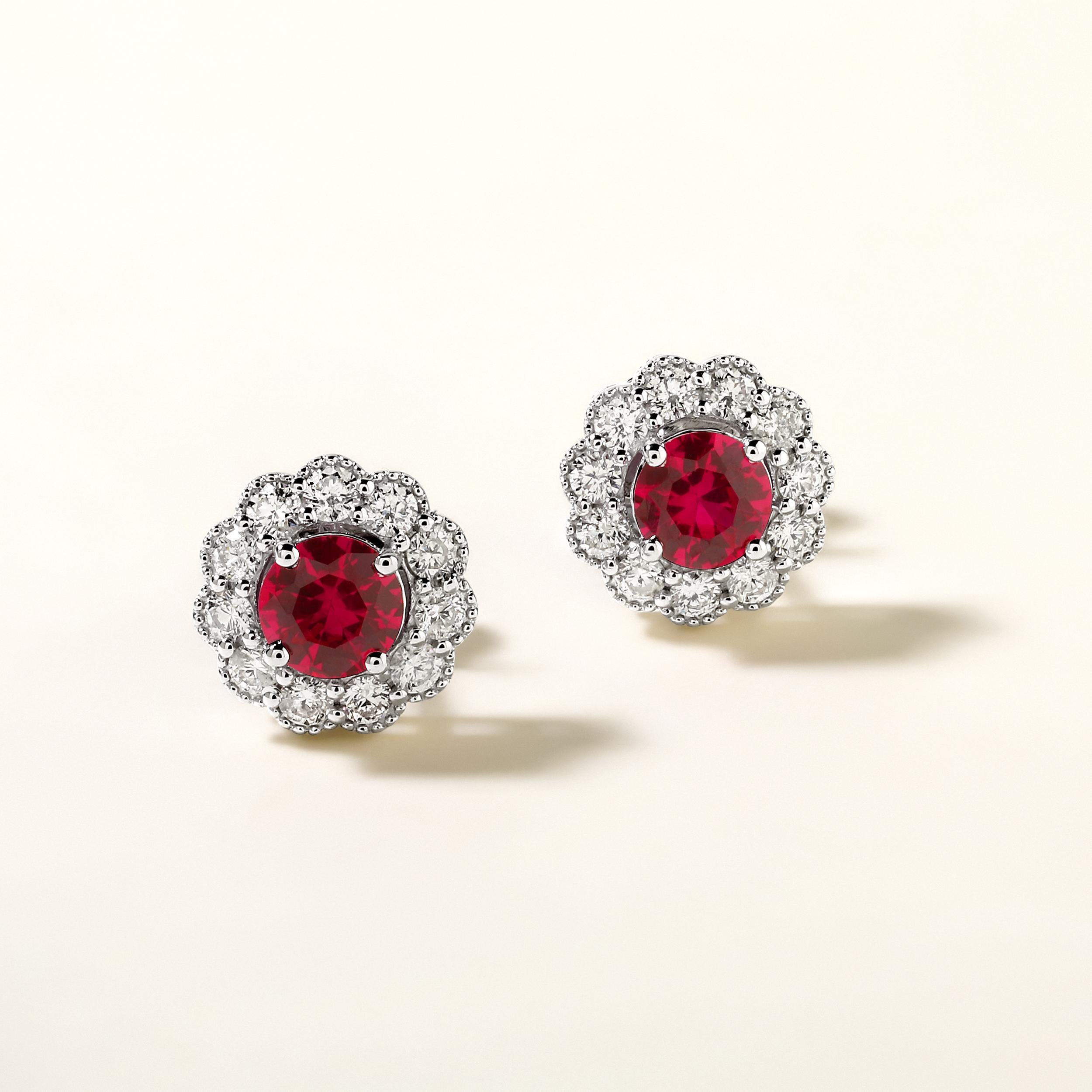 Crafted in 3.4 grams of 14K White Gold, the earrings contains 22 stones of Round Diamonds with a total of 0.62 carat in F-G color and I1-I2 clarity combined with 2 stones of Lab Created Ruby Gemstone with a total of 1.18 carat.

This jewelry piece