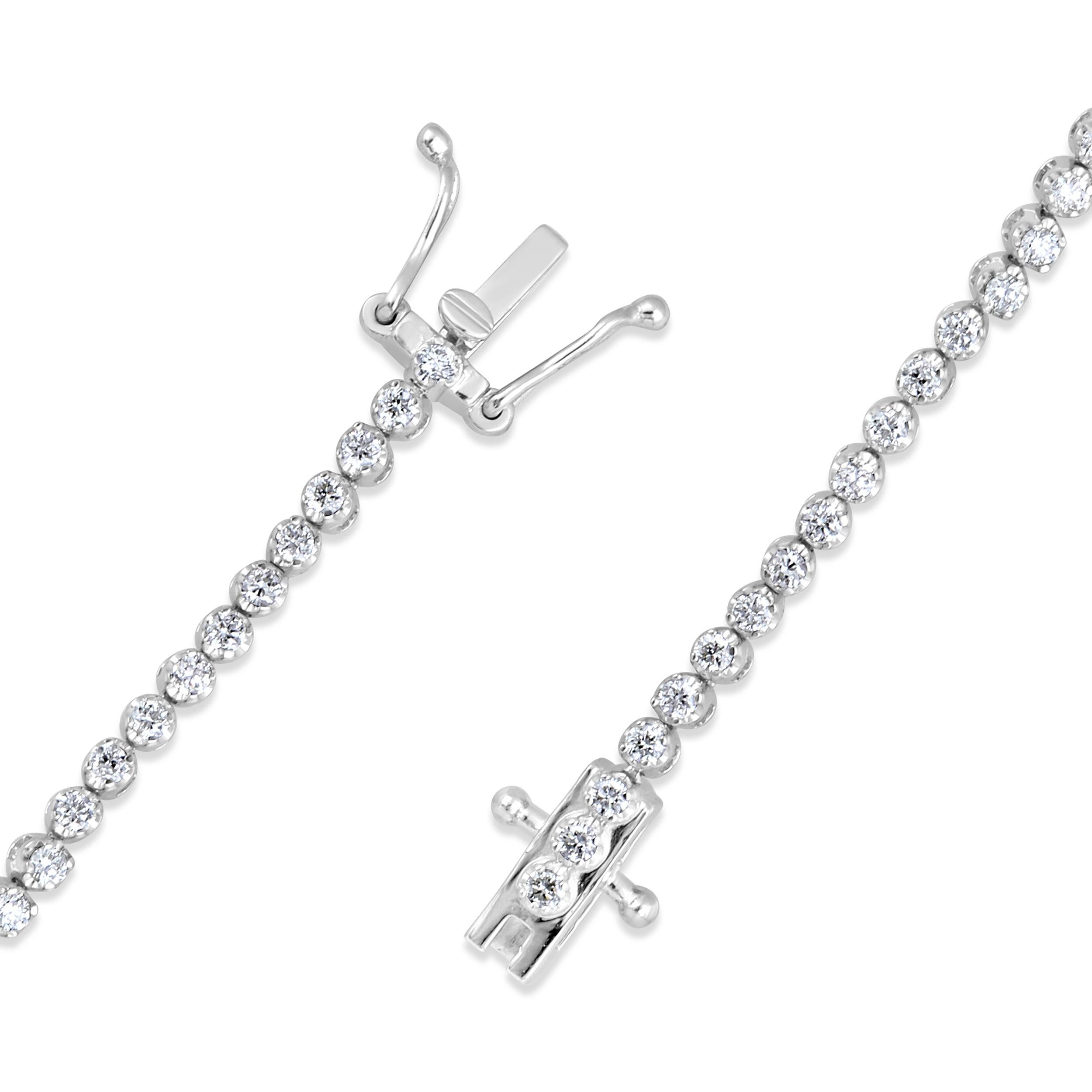 Crafted in 5.11 grams of 14K White Gold, the bracelet contains 88 stones of Round Diamonds with a total of 0.97 carat in G-H color and VS-SI carat. The bracelet length is 7 inches.

CONTEMPORARY AND TIMELESS ESSENCE: Crafted in 14-karat/18-karat