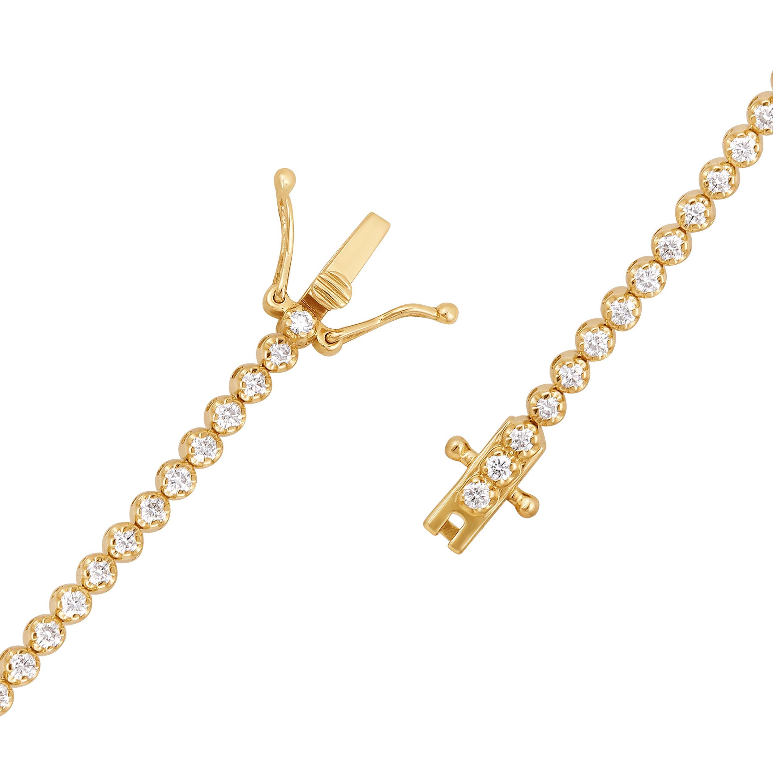 Crafted in 4.82 grams of 14K Yellow Gold, the bracelet contains 90 stones of Round Natural Diamonds with a total of 0.95 carat in G-H color and VS-SI clarity. The bracelet length is 7 inches.

CONTEMPORARY AND TIMELESS ESSENCE: Crafted in