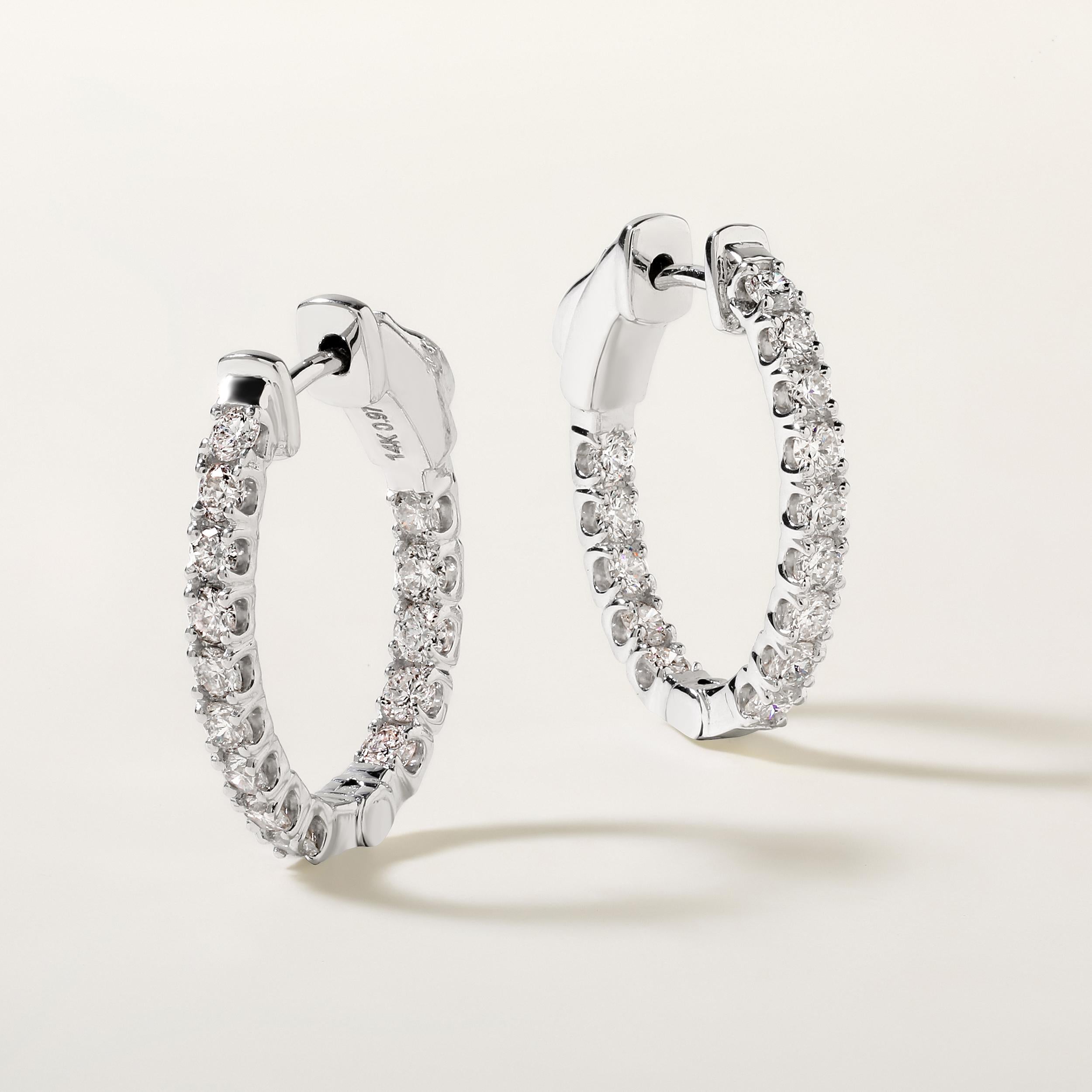 Crafted in 3.84 grams of 14K White Gold, the earrings contains 28 stones of Round Diamonds with a total of 0.97 carat in G-H color and SI clarity.

CONTEMPORARY AND TIMELESS ESSENCE: Crafted in 14-karat/18-karat with 100% natural diamond and