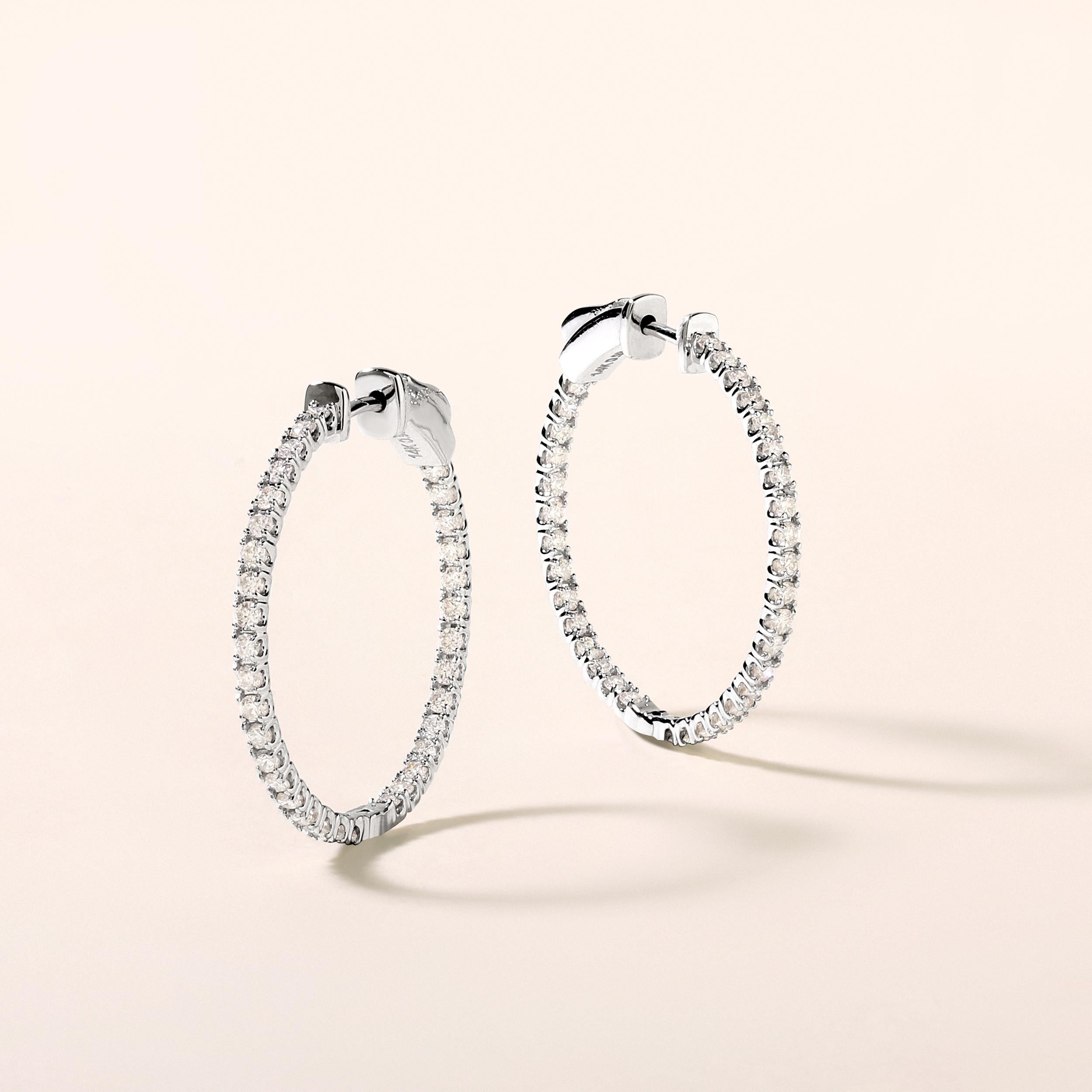 Crafted in 3.64 grams of 14K White Gold, the earrings contains 58 stones of Round Diamonds with a total of 1.01 carat in G-H color and SI clarity.

CONTEMPORARY AND TIMELESS ESSENCE: Crafted in 14-karat/18-karat with 100% natural diamond and