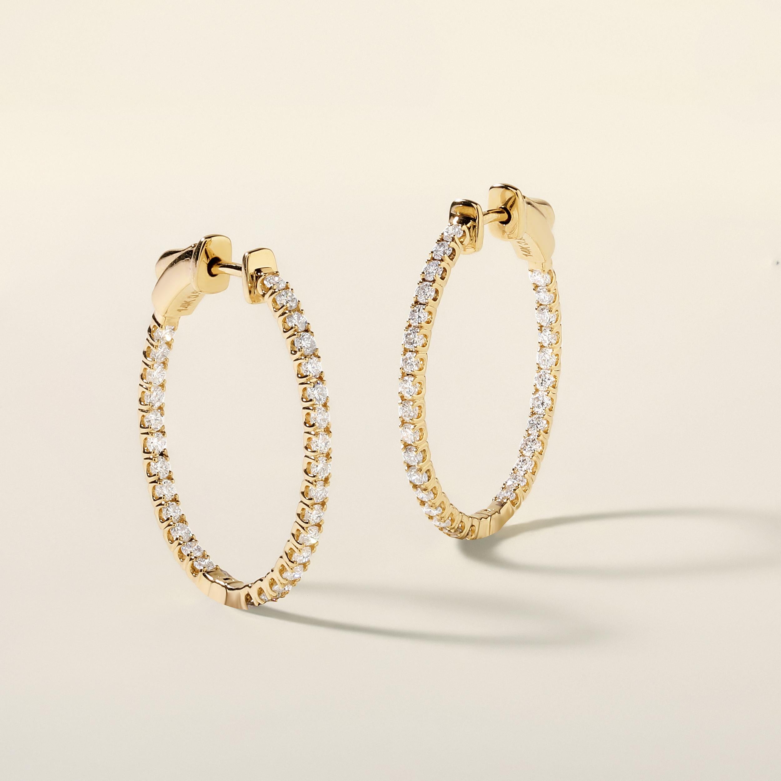 Crafted in 3.55 grams of 14K Yellow Gold, the earrings contains 58 stones of Round Diamonds with a total of 0.98 carat in G-H color and SI clarity.

CONTEMPORARY AND TIMELESS ESSENCE: Crafted in 14-karat/18-karat with 100% natural diamond and