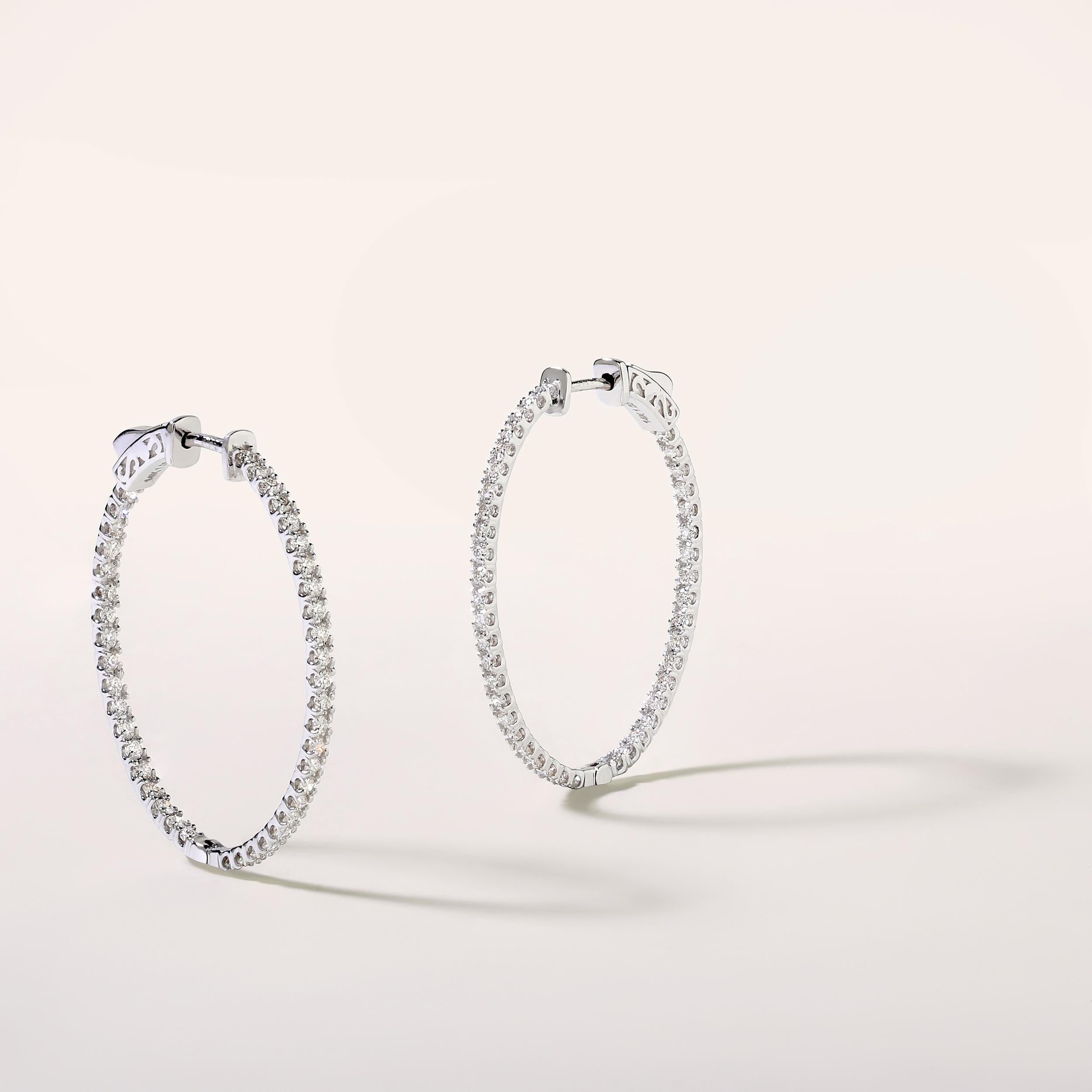 Crafted in 3.74 grams of 14K White Gold, the earrings contains 84 stones of Round Diamonds with a total of 1 carat in G-H color and SI clarity.

CONTEMPORARY AND TIMELESS ESSENCE: Crafted in 14-karat/18-karat with 100% natural diamond and designed