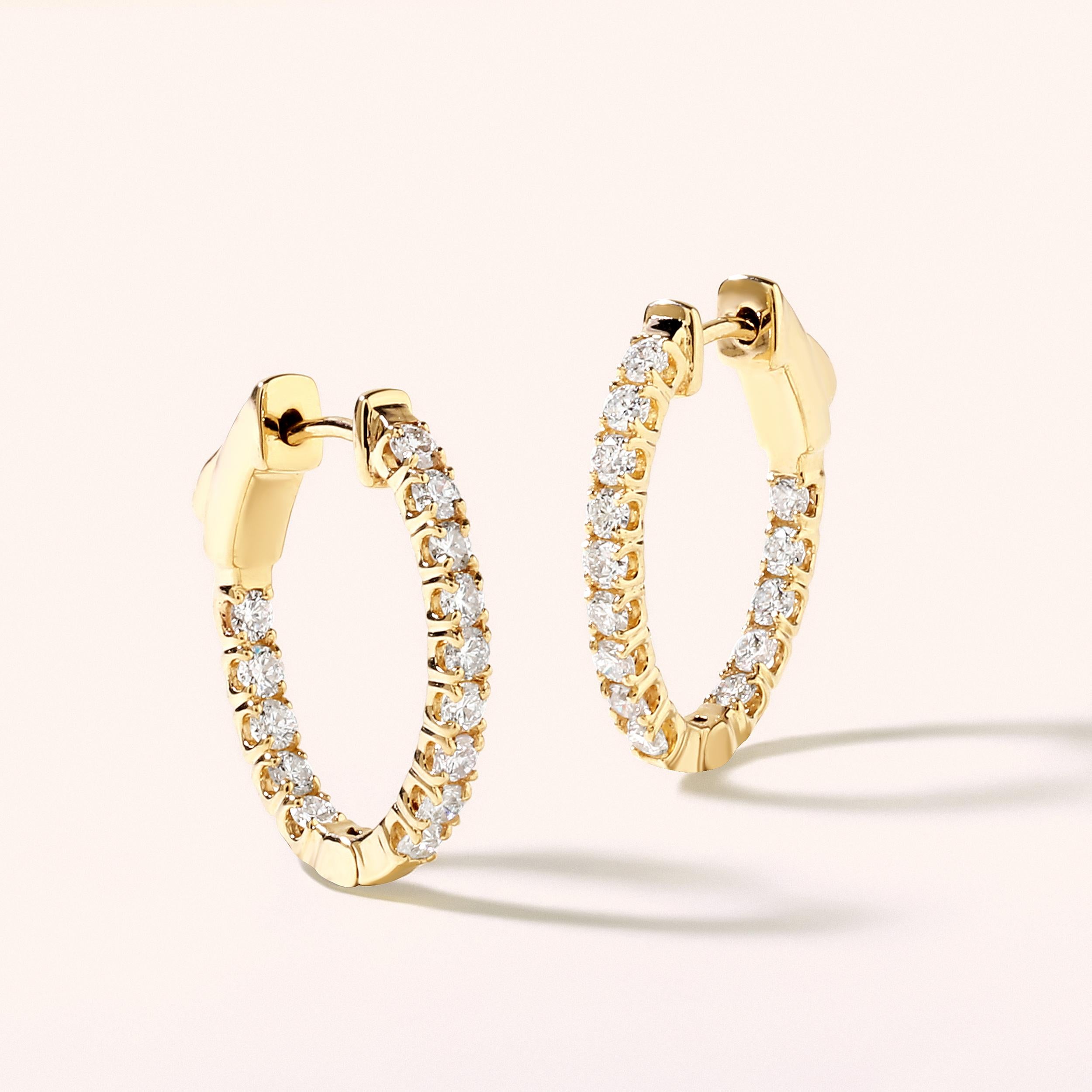 Crafted in 3.75 grams of 14K Yellow Gold, the earrings contains 28 stones of Round Diamonds with a total of 0.97 carat in F-G color and SI clarity.

CONTEMPORARY AND TIMELESS ESSENCE: Crafted in 14-karat/18-karat with 100% natural diamond and