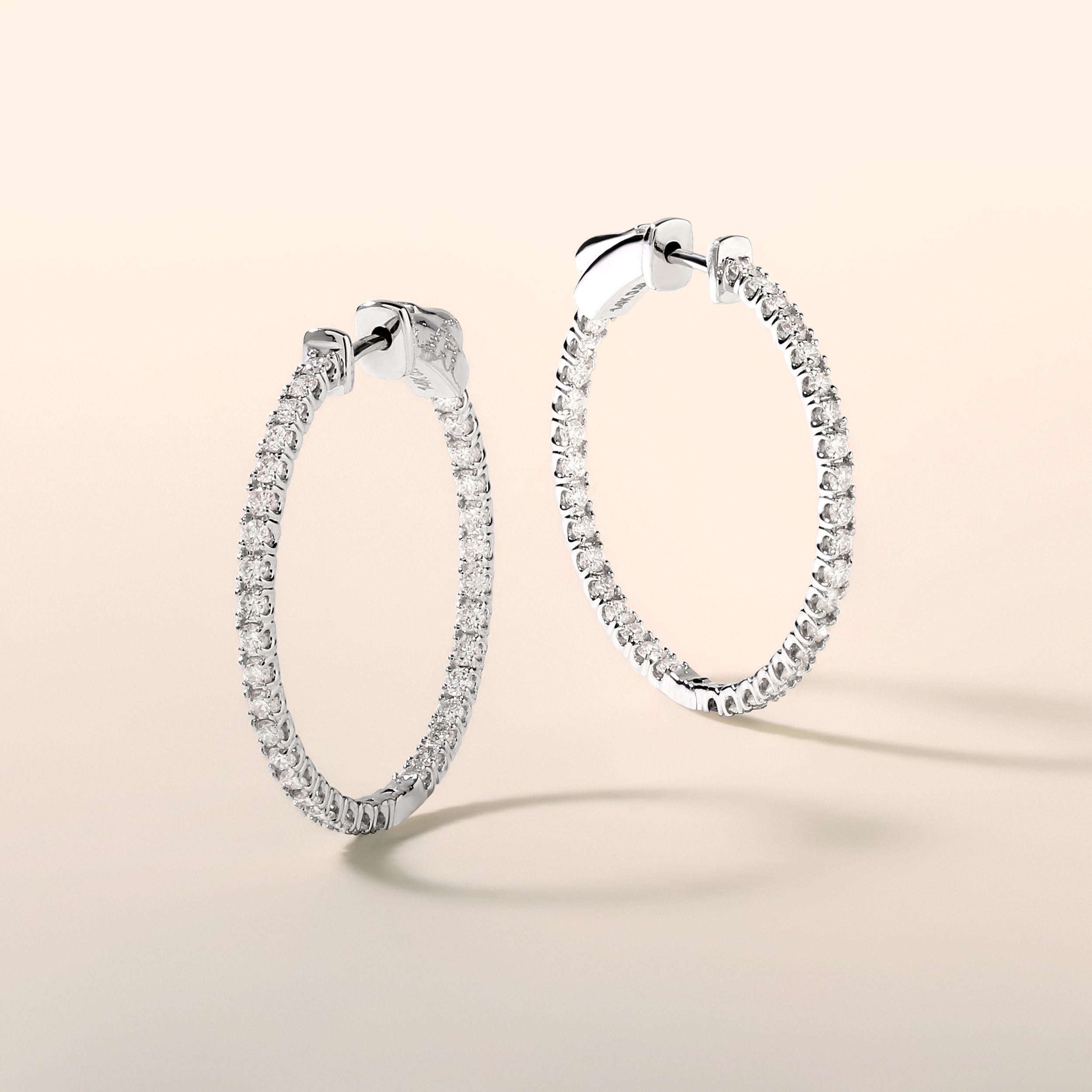 Crafted in 3.8 grams of 14K White Gold, the earrings contains 68 stones of Round Diamonds with a total of 0.98 carat in G-H color and SI clarity.

CONTEMPORARY AND TIMELESS ESSENCE: Crafted in 14-karat/18-karat with 100% natural diamond and designed