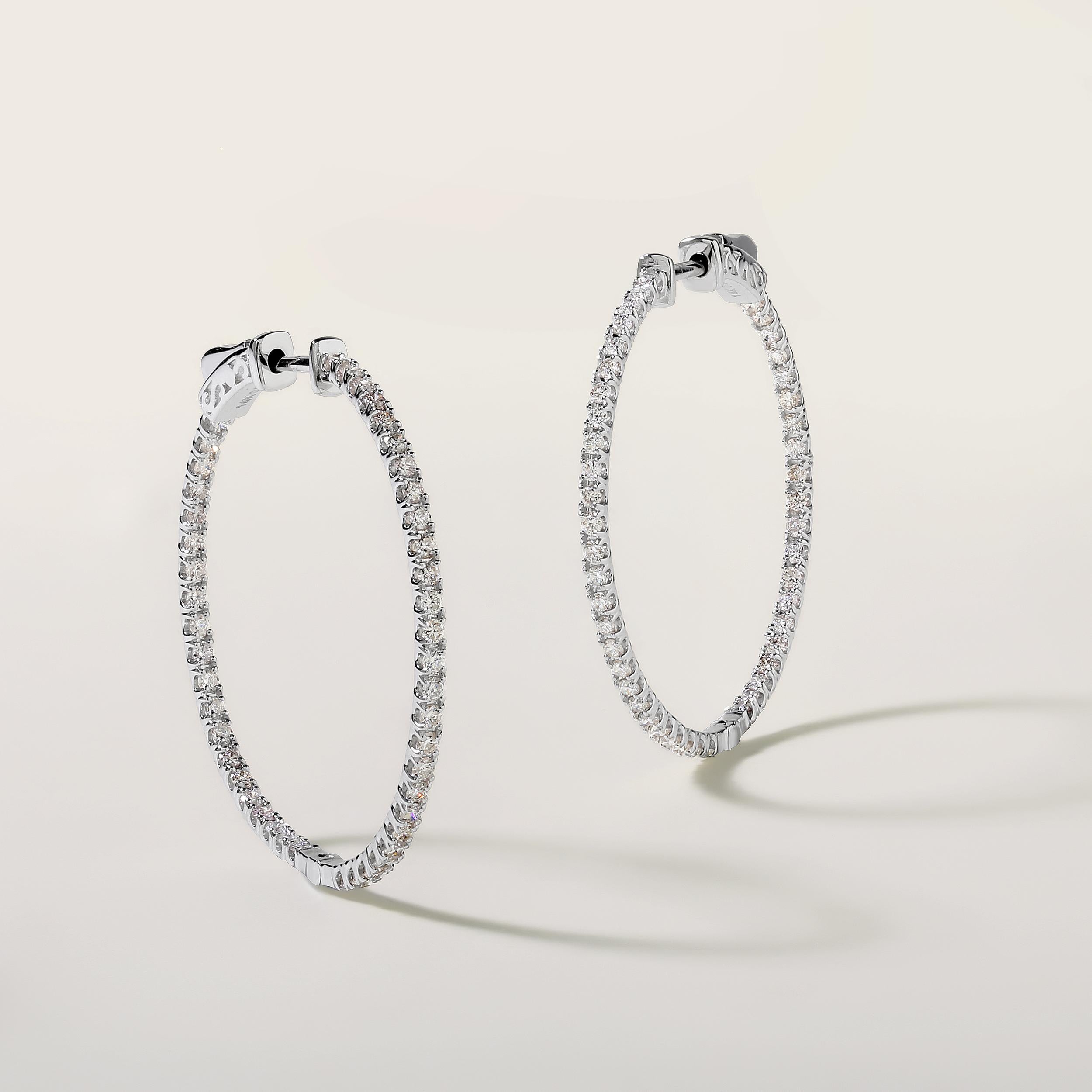 Crafted in 3.93 grams of 14K White Gold, the earrings contains 92 stones of Round Diamonds with a total of 0.99 carat in G-H color and SI clarity.

CONTEMPORARY AND TIMELESS ESSENCE: Crafted in 14-karat/18-karat with 100% natural diamond and