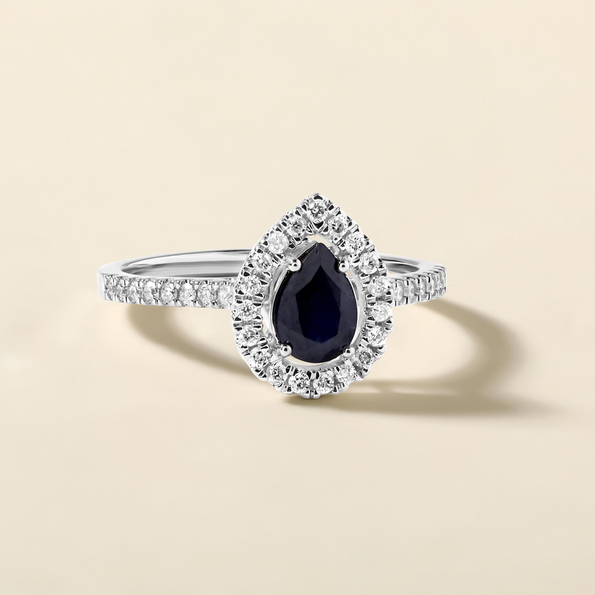 Ring Size: US 7

Crafted in 2.52 grams of 14K White Gold, the ring contains 35 stones of Round Natural Diamonds with a total of 0.28 carat in G-H color and I1-I2 clarity combined with 1 stone of Pear Shaped Natural Sapphire Gemstone with a total of