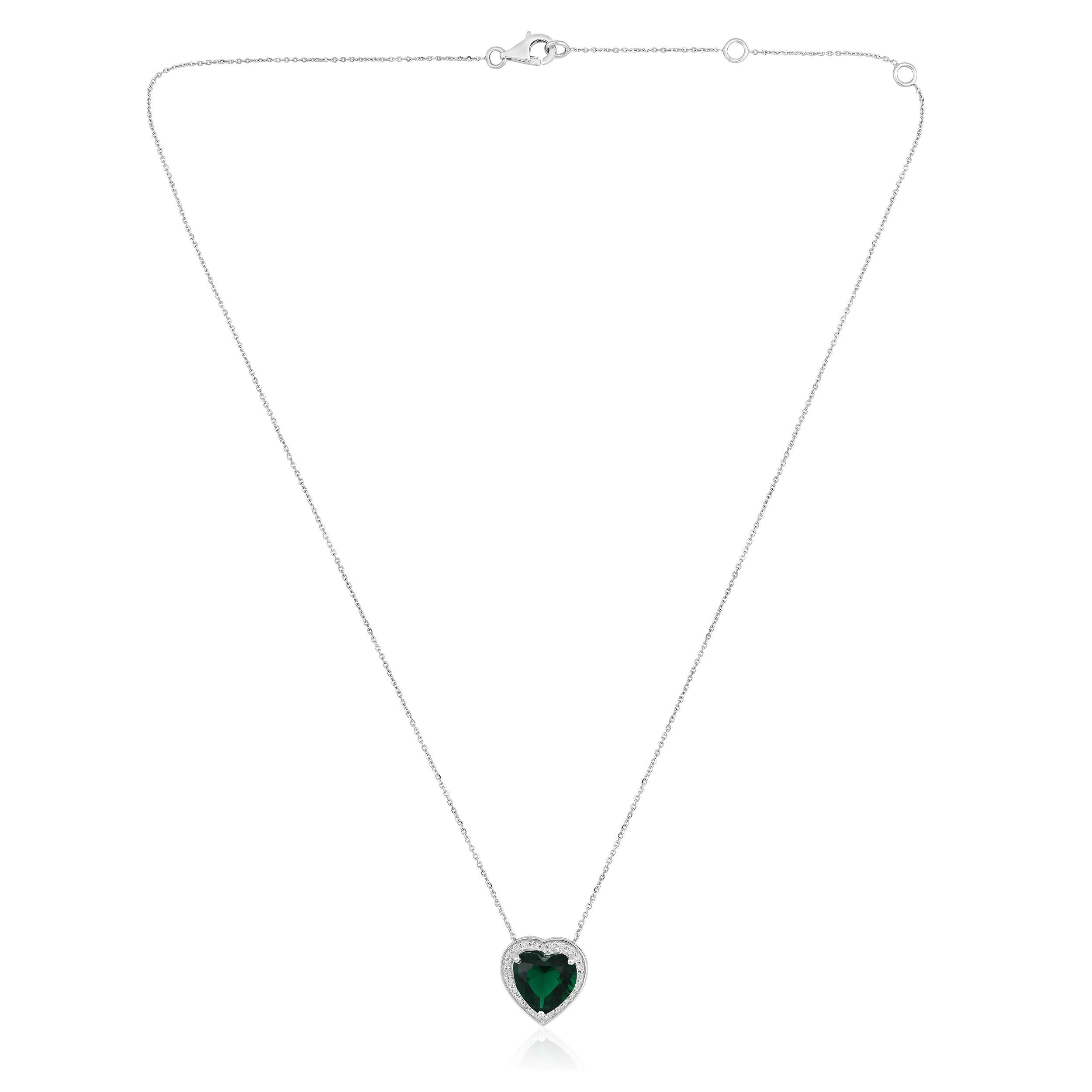Crafted in 3.24 grams of 14K White Gold, the necklace contains 24 stones of Round Diamonds with a total of 0.21 carat in F-G color and I1-I2 clarity combined with 1 stone of Lab Created Emerald Gemstone with a total of 1.97 carat. The necklace