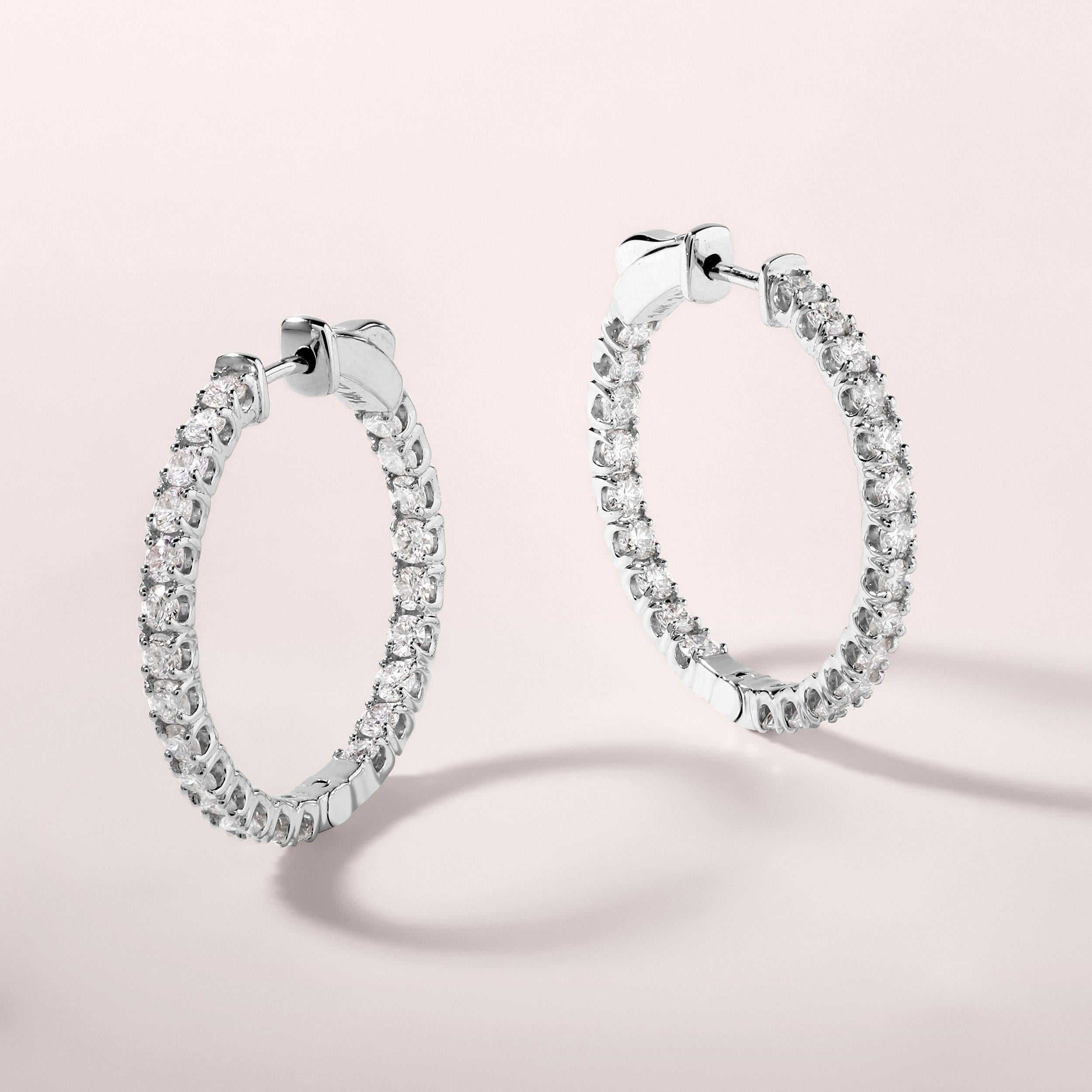 Crafted in 5.91 grams of 14K White Gold, the earrings contains 46 stones of Round Diamonds with a total of 2.01 carat in F-G color and SI clarity.

CONTEMPORARY AND TIMELESS ESSENCE: Crafted in 14-karat/18-karat with 100% natural diamond and