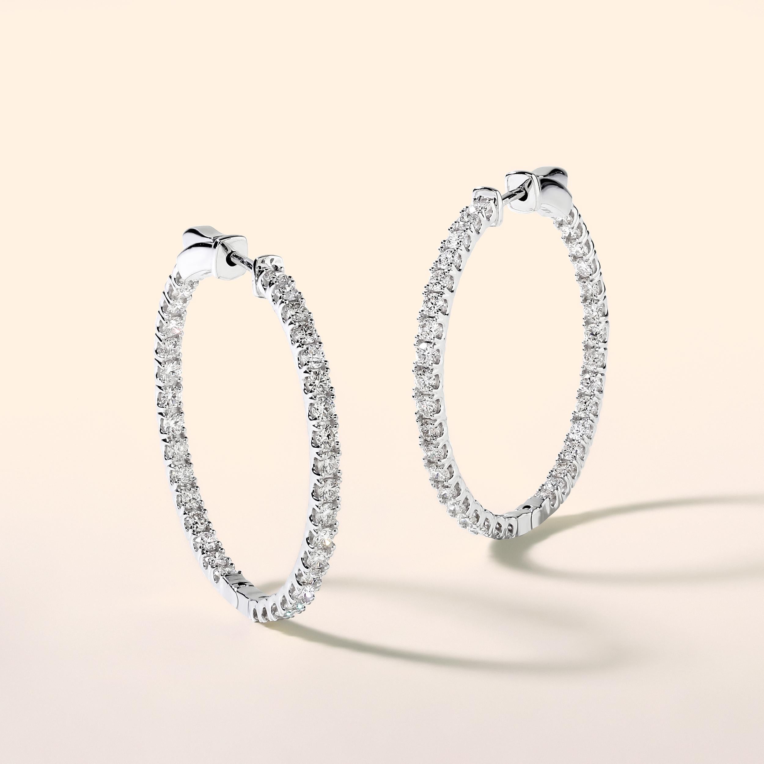 Crafted in 6.17 grams of 14K White Gold, the earrings contains 68 stones of Round Diamonds with a total of 2 carat in G-H color and SI clarity.

CONTEMPORARY AND TIMELESS ESSENCE: Crafted in 14-karat/18-karat with 100% natural diamond and designed