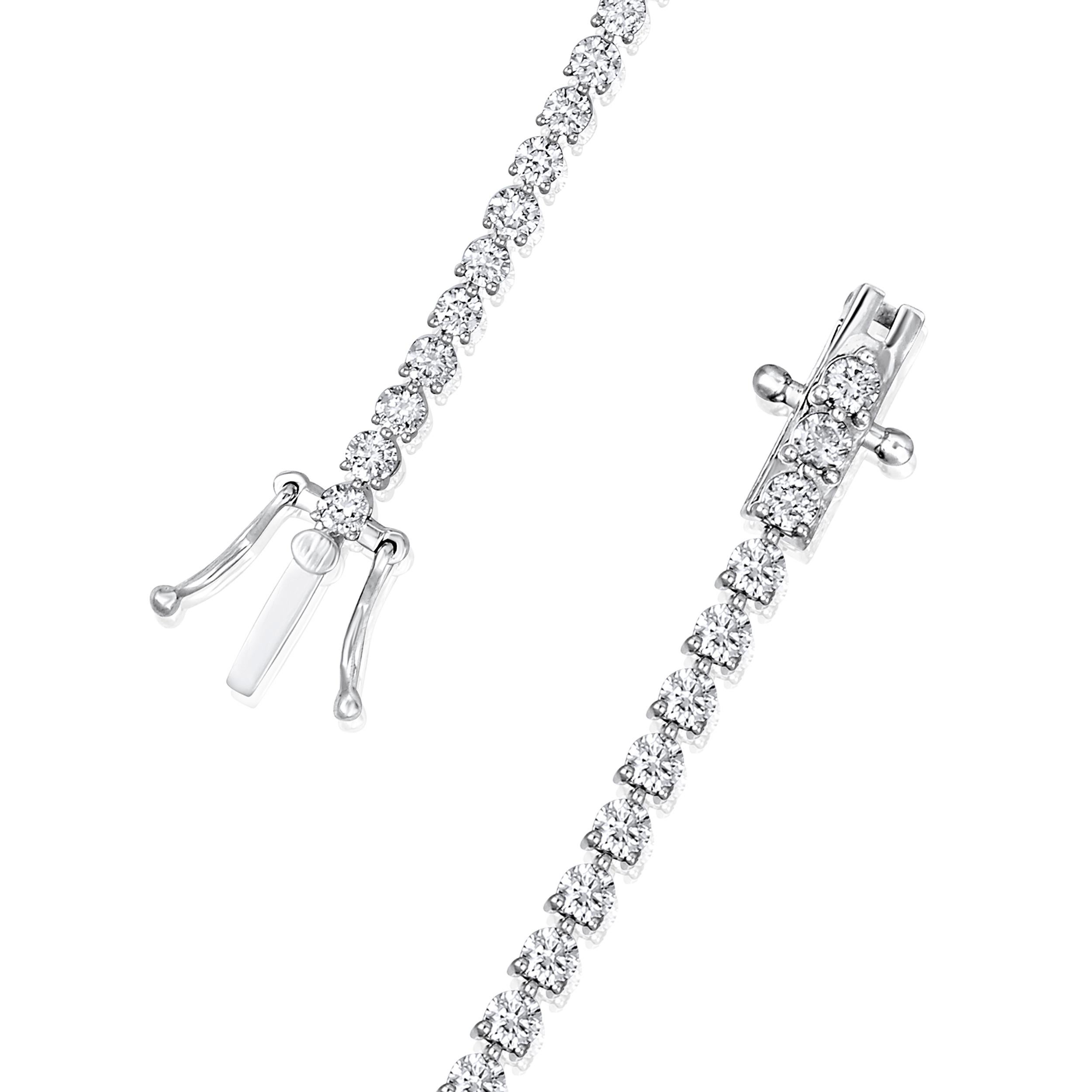 Crafted in 7.7 grams of 14K White Gold, the bracelet contains 66 stones of Round Diamonds with a total of 3 carat in G-H color and VS-SI carat. The bracelet length is 7 inches.

This jewelry piece will be expertly crafted by our skilled artisans