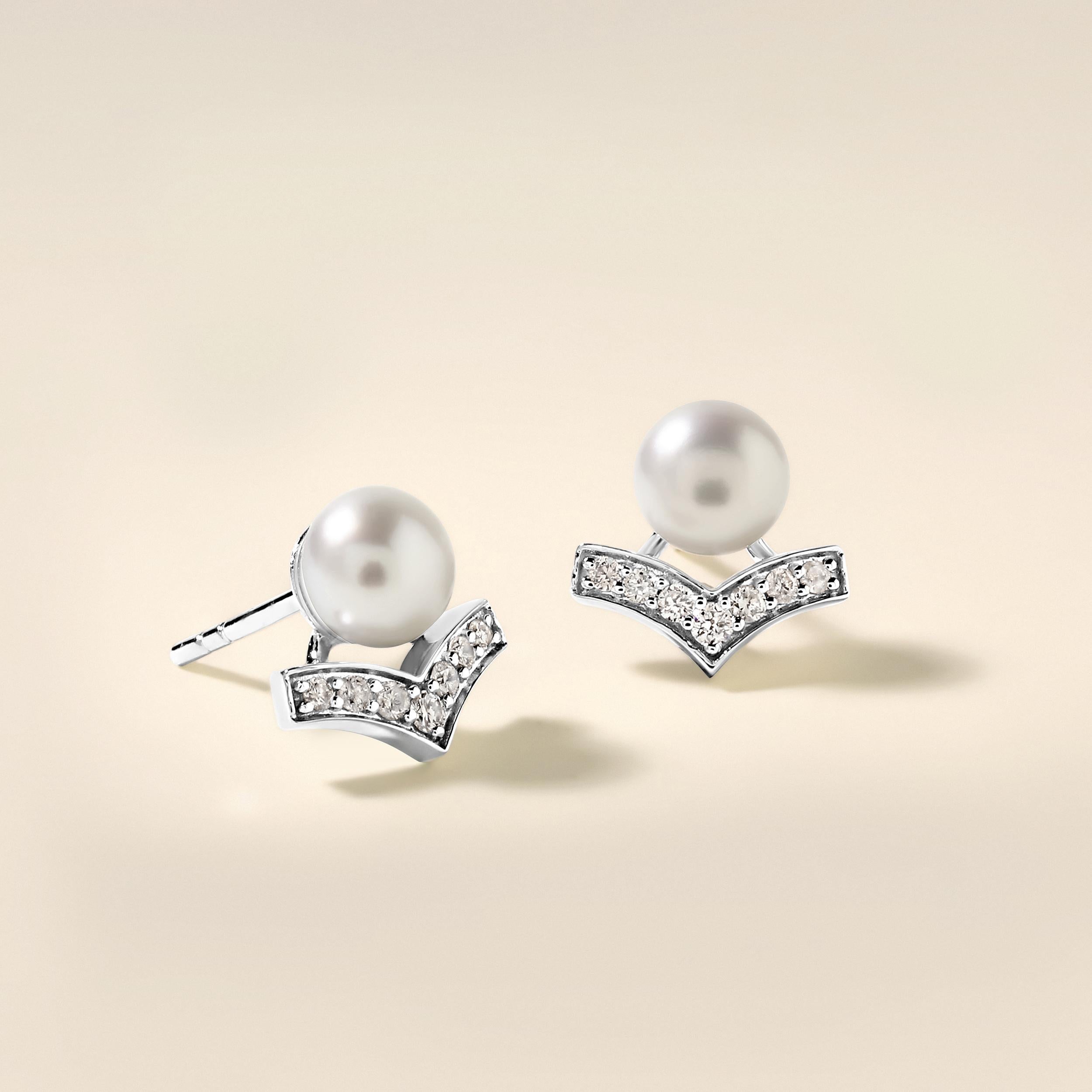 Crafted in 3.02 grams of 14K White Gold, the earrings contains 14 stones of Round Diamonds with a total of 0.19 carat in F-G color and I1-I2 clarity combined with 2 stones of Cultured Pearls with a total of 2.74 carat.

CONTEMPORARY AND TIMELESS