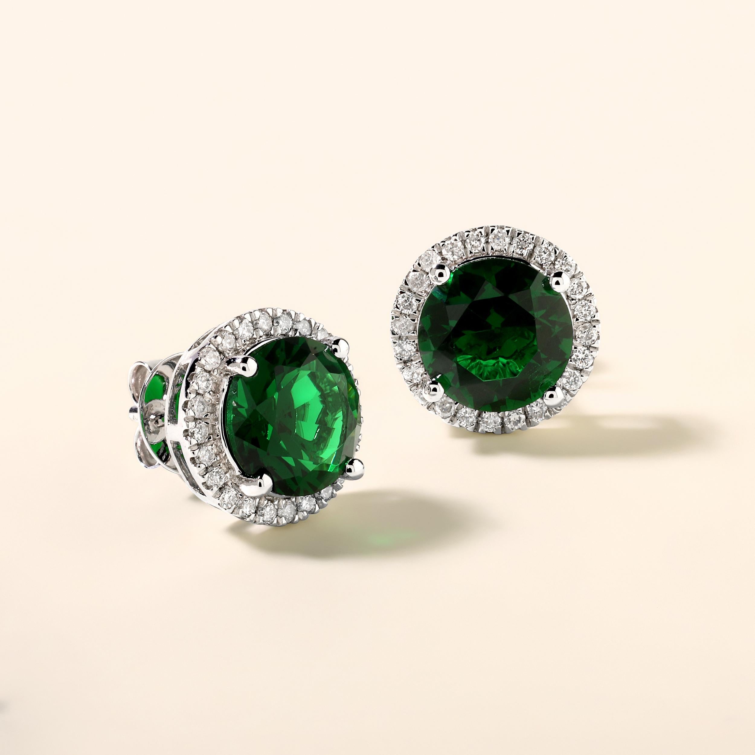 Crafted in 5.45 grams of 14K White Gold, the earrings contains 48 stones of Round Diamonds with a total of 0.45 carat in F-G color and I1-I2 clarity combined with 2 stones of Lab Created Emerald Gemstone with a total of 4.26 carat.

This jewelry