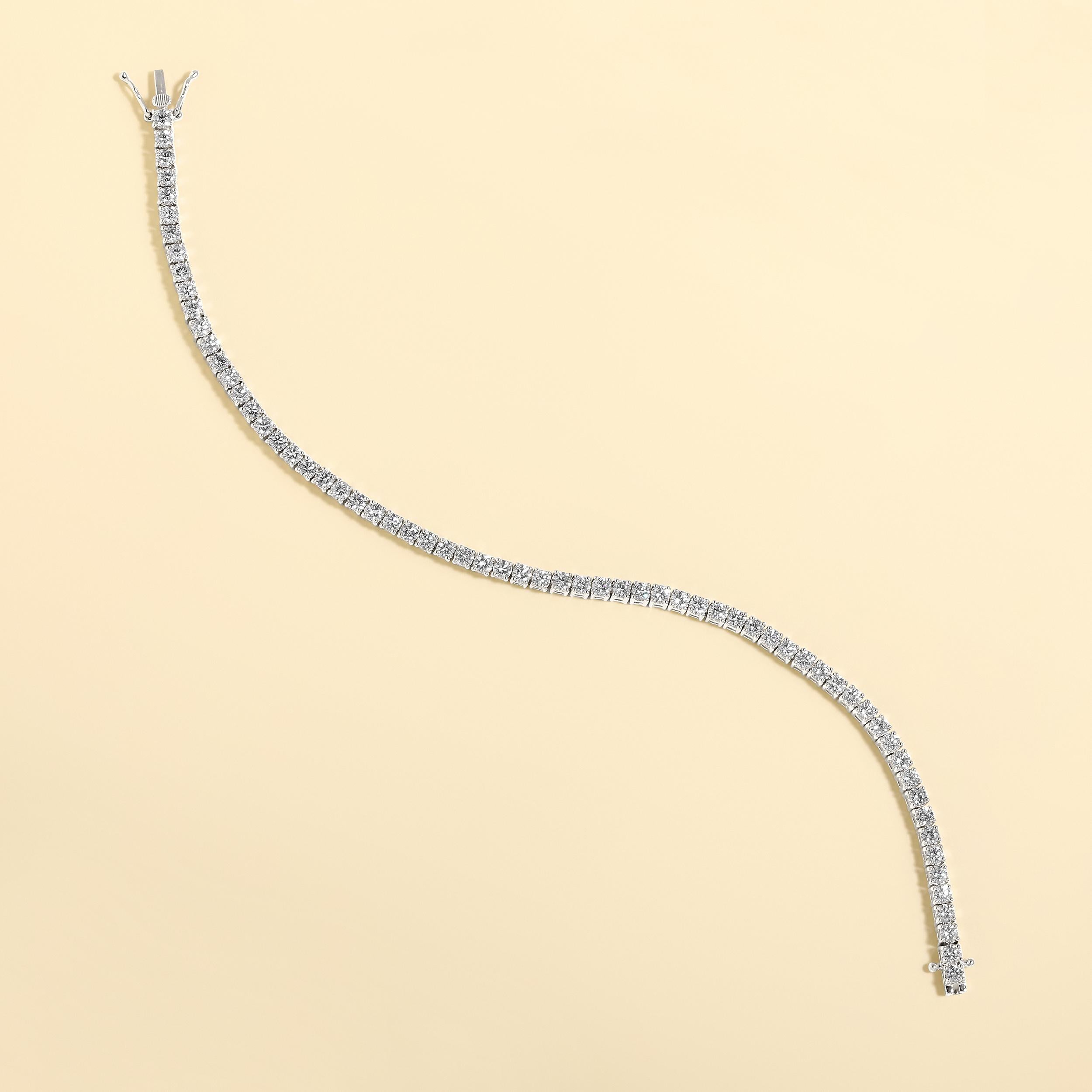 Crafted in 12.12 grams of 14K White Gold, the bracelet contains 61 stones of Round Natural Diamonds with a total of 4.02 carat in G-H color and VS-SI clarity. The bracelet length is 7.5 inches.

CONTEMPORARY AND TIMELESS ESSENCE: Crafted in