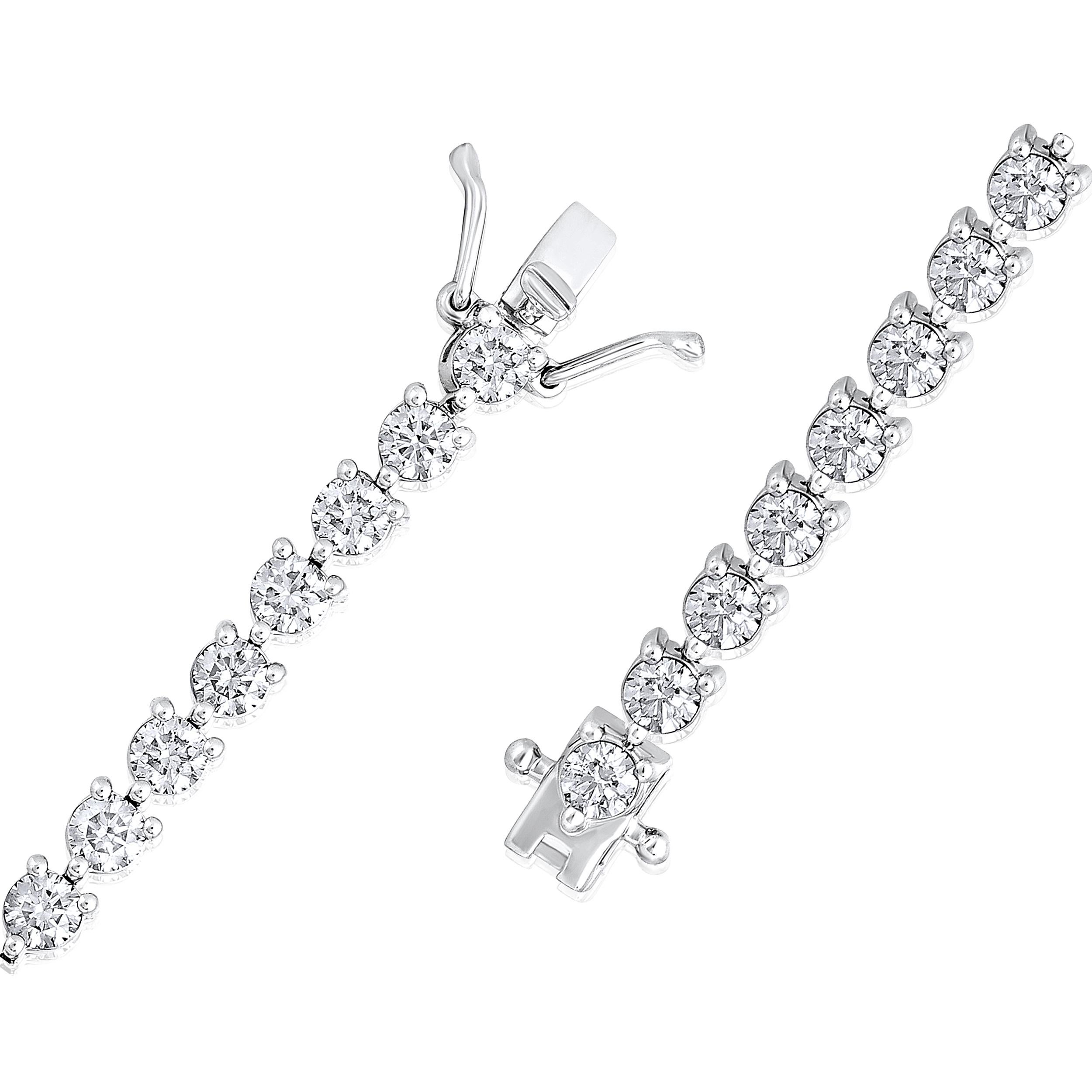Crafted in 9.87 grams of 14K White Gold, the bracelet contains 43 stones of Round Diamonds with a total of 5.2 carat in G-H color and VS-SI carat. The bracelet length is 7 inches.

CONTEMPORARY AND TIMELESS ESSENCE: Crafted in 14-karat/18-karat with