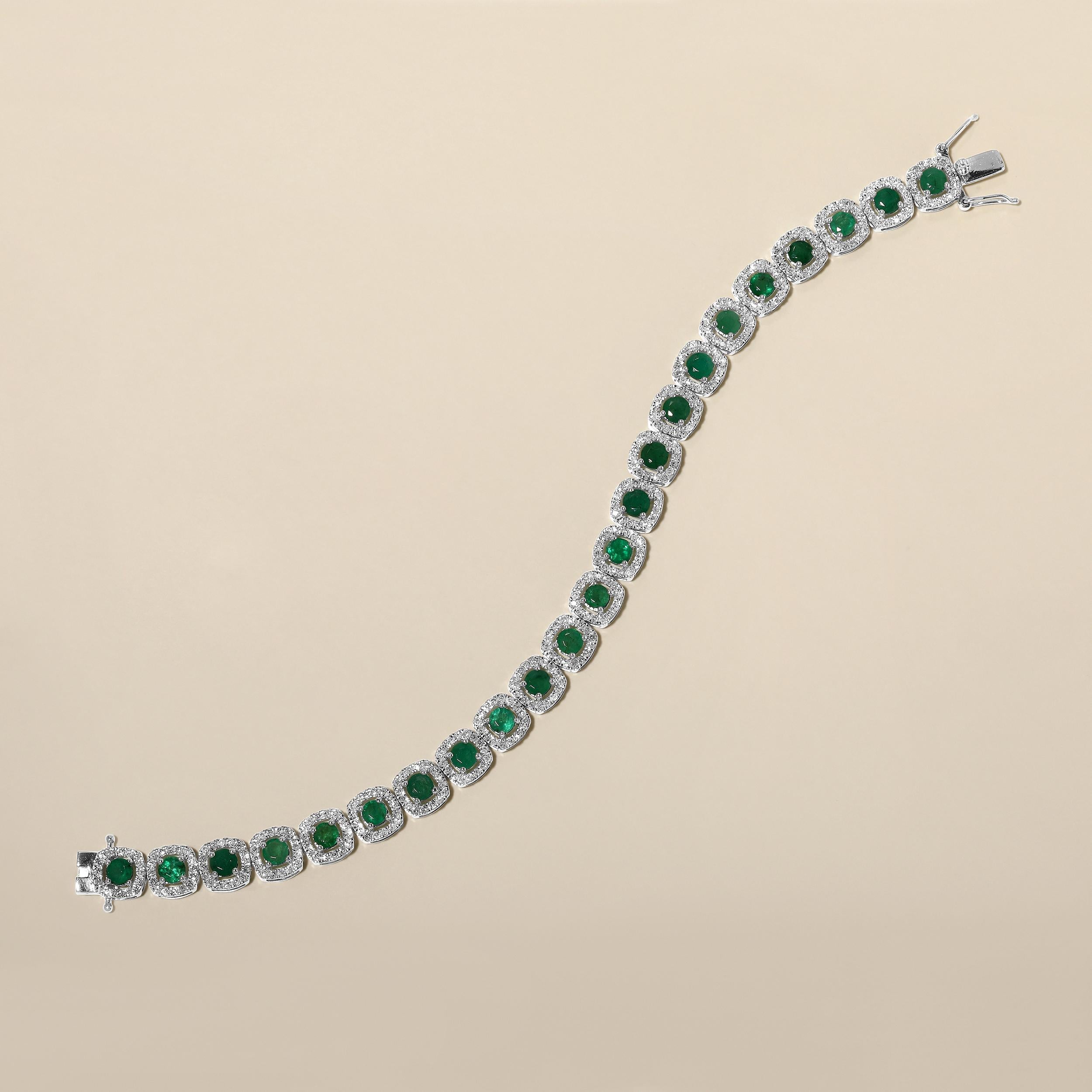 Crafted in 13.08 grams of 14K White Gold, the bracelet contains 368 stones of Round Natural Diamonds with a total of 2.58 carat in F-G color and I1-I2 clarity combined with 23 stones of Round Shaped Natural Emerald Gemstones with a total of 5.09