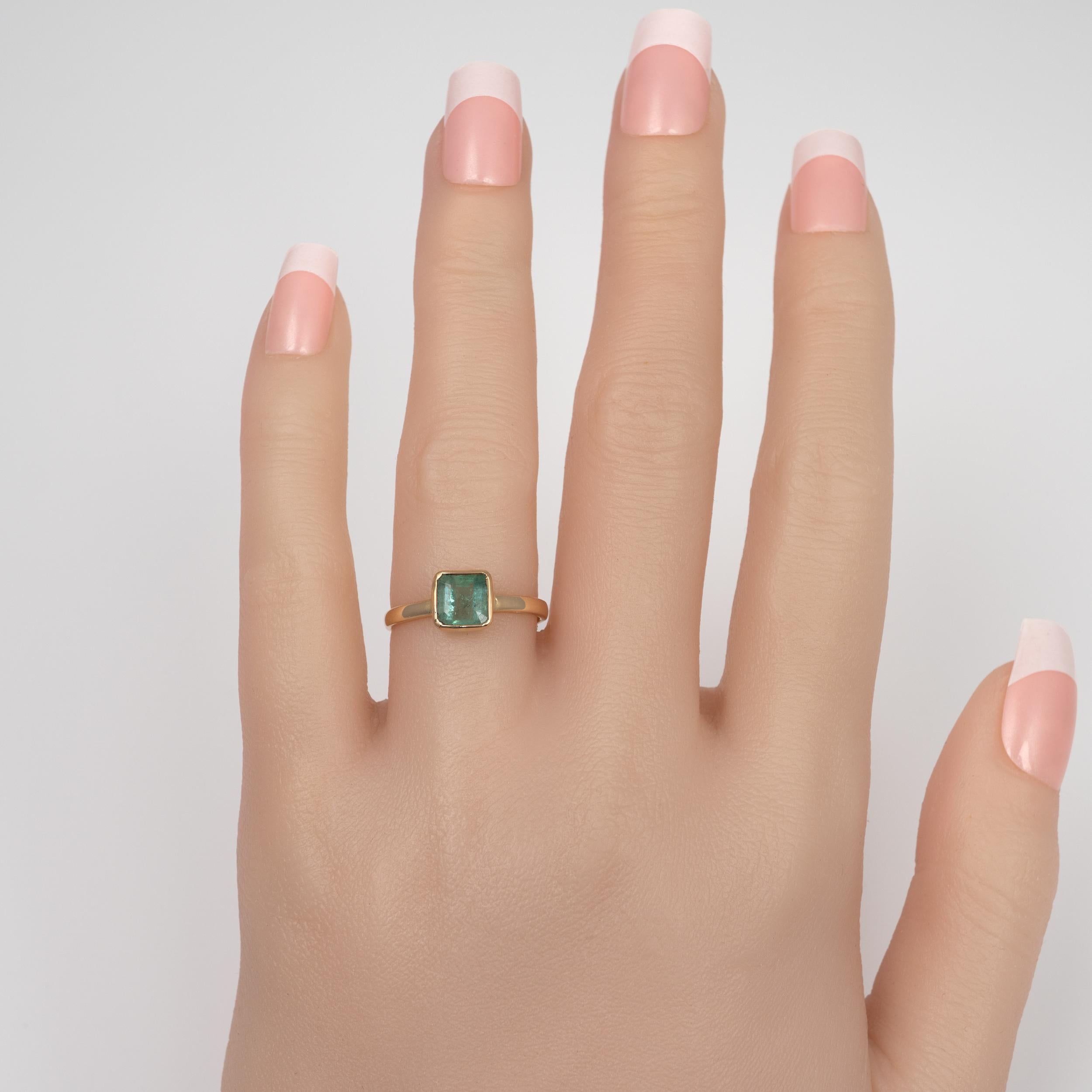 A beautiful modern Bezel Emerald solitaire ring 18 karat yellow gold.

The octagon square precious emerald gemstone is bezel set in a contemporary minimalistic style. The yellow gold is hallmarked and the ring is polished to a beautiful finish.The