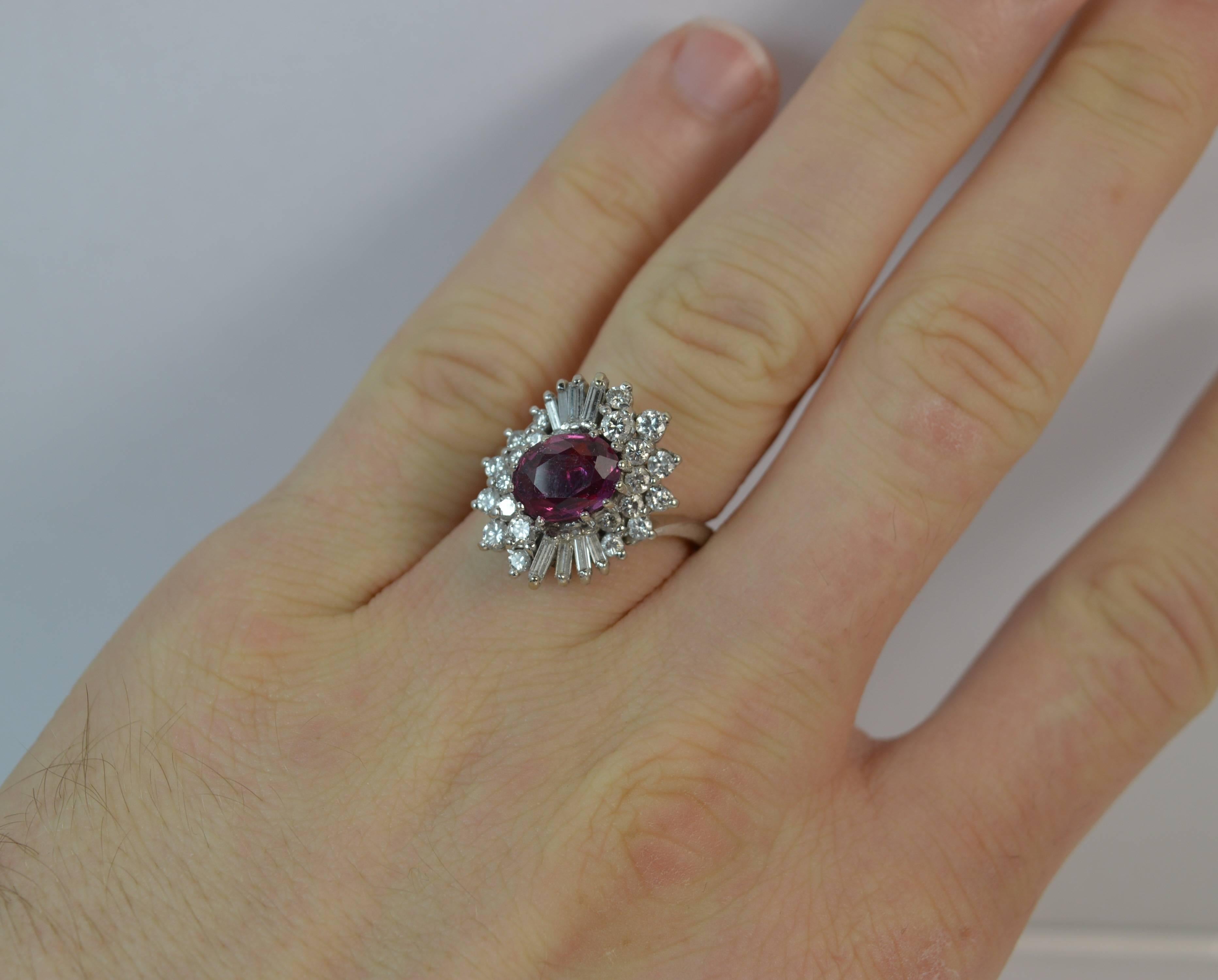 A stunning Ruby and Diamond cluster ring with Anchor Cert gem report.

A solid 18 carat white gold shank and setting.

​The abstract cluster is set with a natural ruby to centre of approx 6.6mm x 8.7mm and the certificate states no