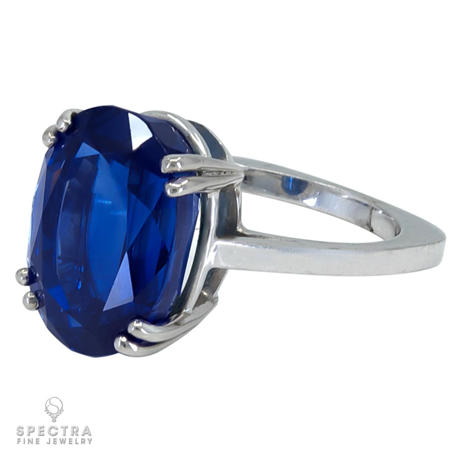 This beautiful cocktail ring is featuring a 15.29 carat natural oval sapphire. 
The sapphire is certified by SSEF, stating that it has no indication of thermal treatment. Origin is undetermined.
The band has a unique shape with two rounded corners
