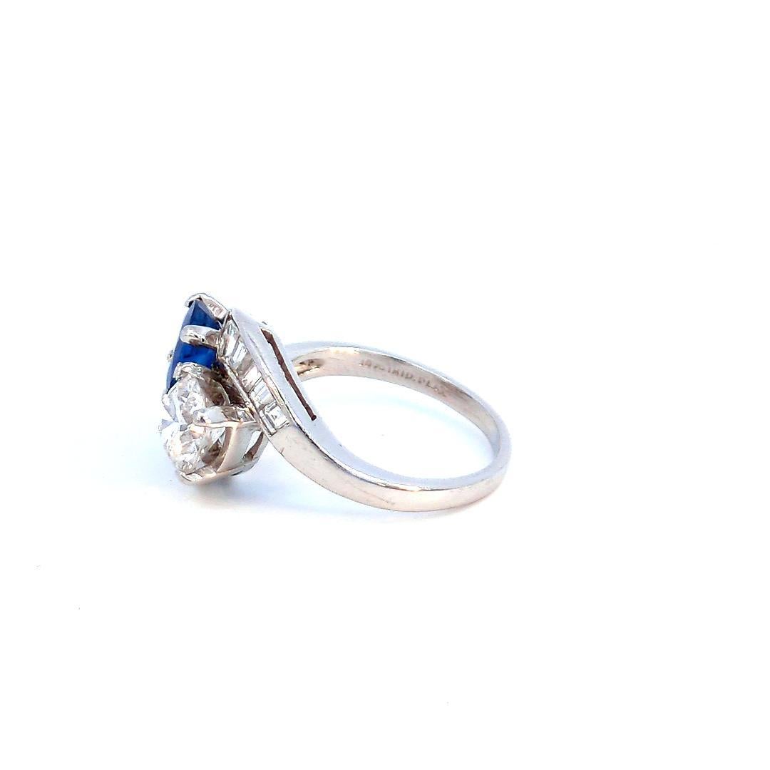 Brilliant Cut Certified 1.56 Carats Blue Sapphire And 1.30 Carats Diamond 2 Stone Ring For Sale