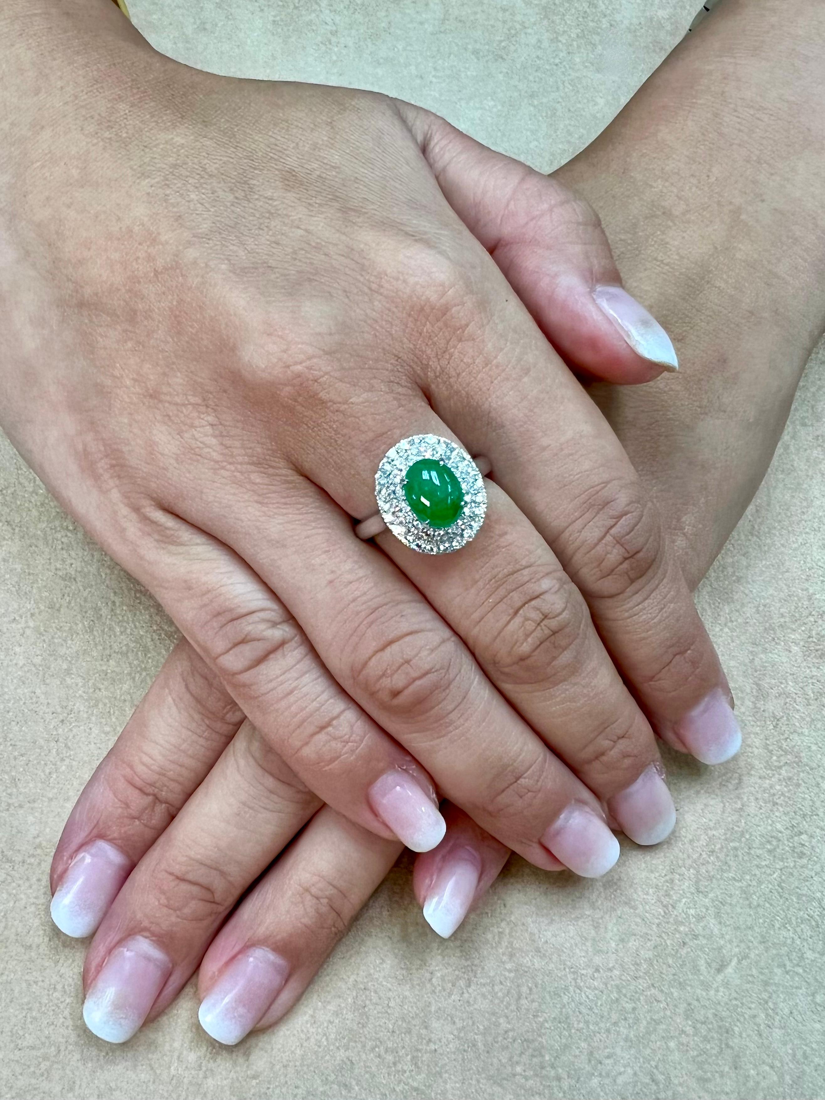 Please check out the HD video. Here is a bright apple green oval cabochon jade and diamond cocktail ring. This ring looks better in person! It is certified as natural jadeite jade with no treatment or enhancement. The ring is set in 18k white gold