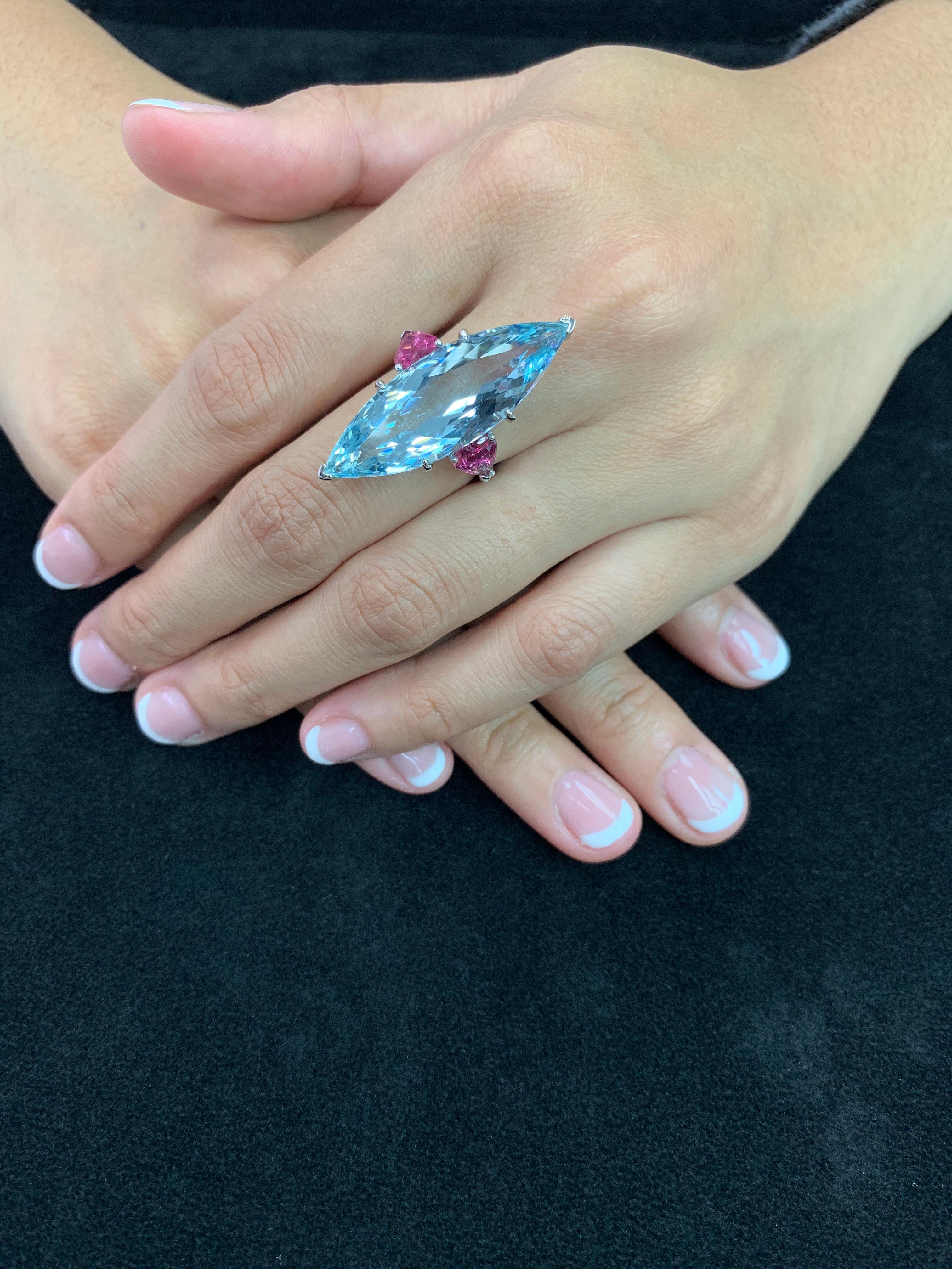 This is a STATEMENT piece! Here is a super nice certified natural Aquamarine ring. Unique is an understatement. The center Aquamarine is 16 Cts. Not only is it oversized, the clarity is exceptional. The unique oversized Marquis shape aquamarine with