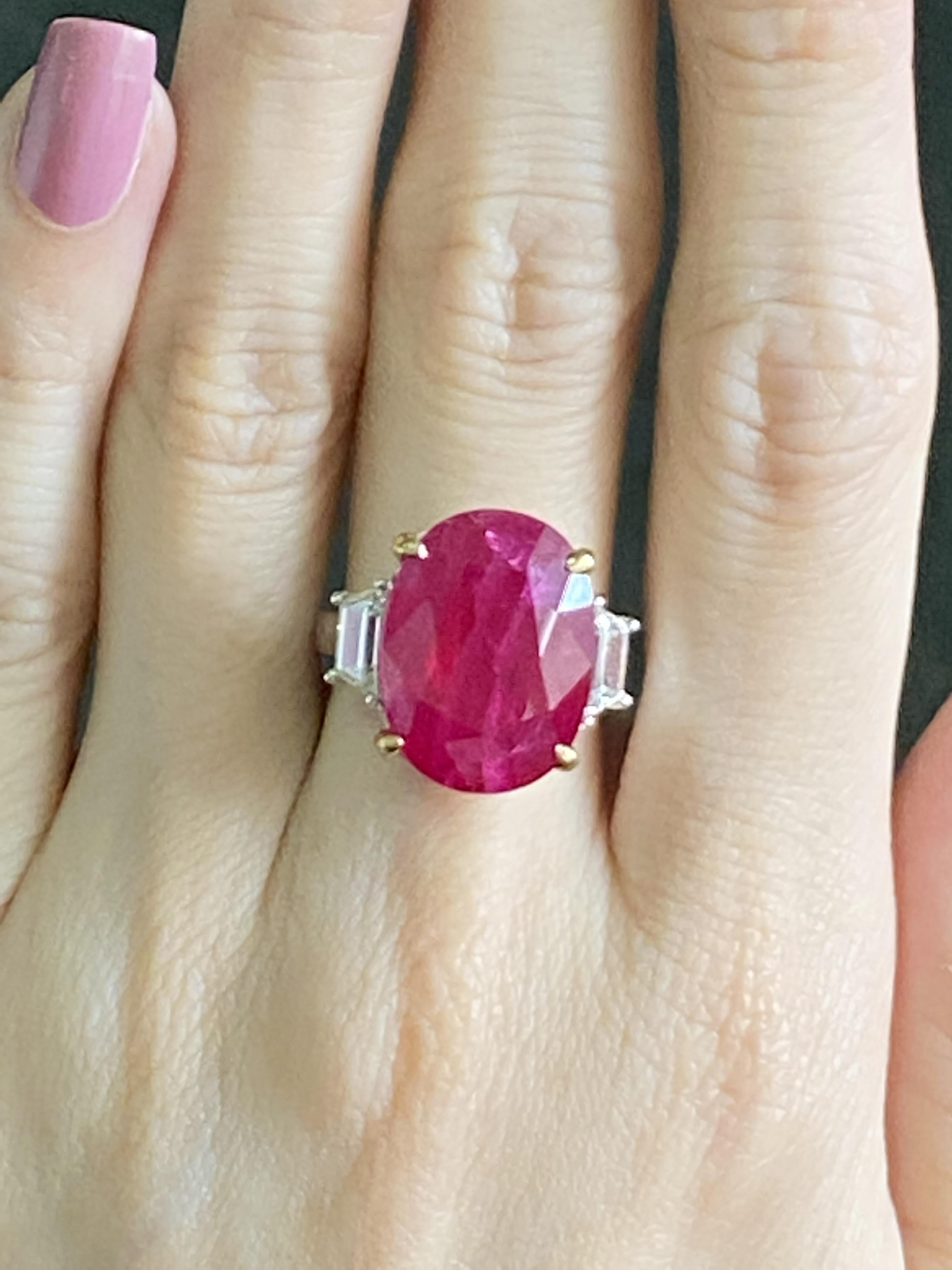 A classic three-stone engagement ring, with a natural 17.04 carat Burmese Ruby, and 1.03 carats VS quality side-stone Diamonds. The Ruby has a beautiful pinkish-red hue, and is set in a solid 18K White Gold casing with Yellow Gold prongs. The ring