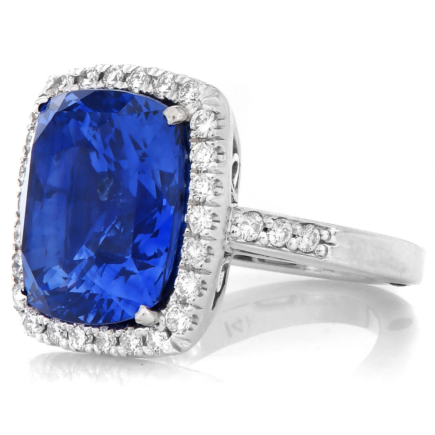 This exquisite hand-made cocktail Ring, presented a deep blue sapphire Adorned by a diamond halo, reassuring a luxurious and majestic look.

Crafted in solid 14K White Gold, Featuring in the center an exceptional Cushion Cut, AGL Certified Sri