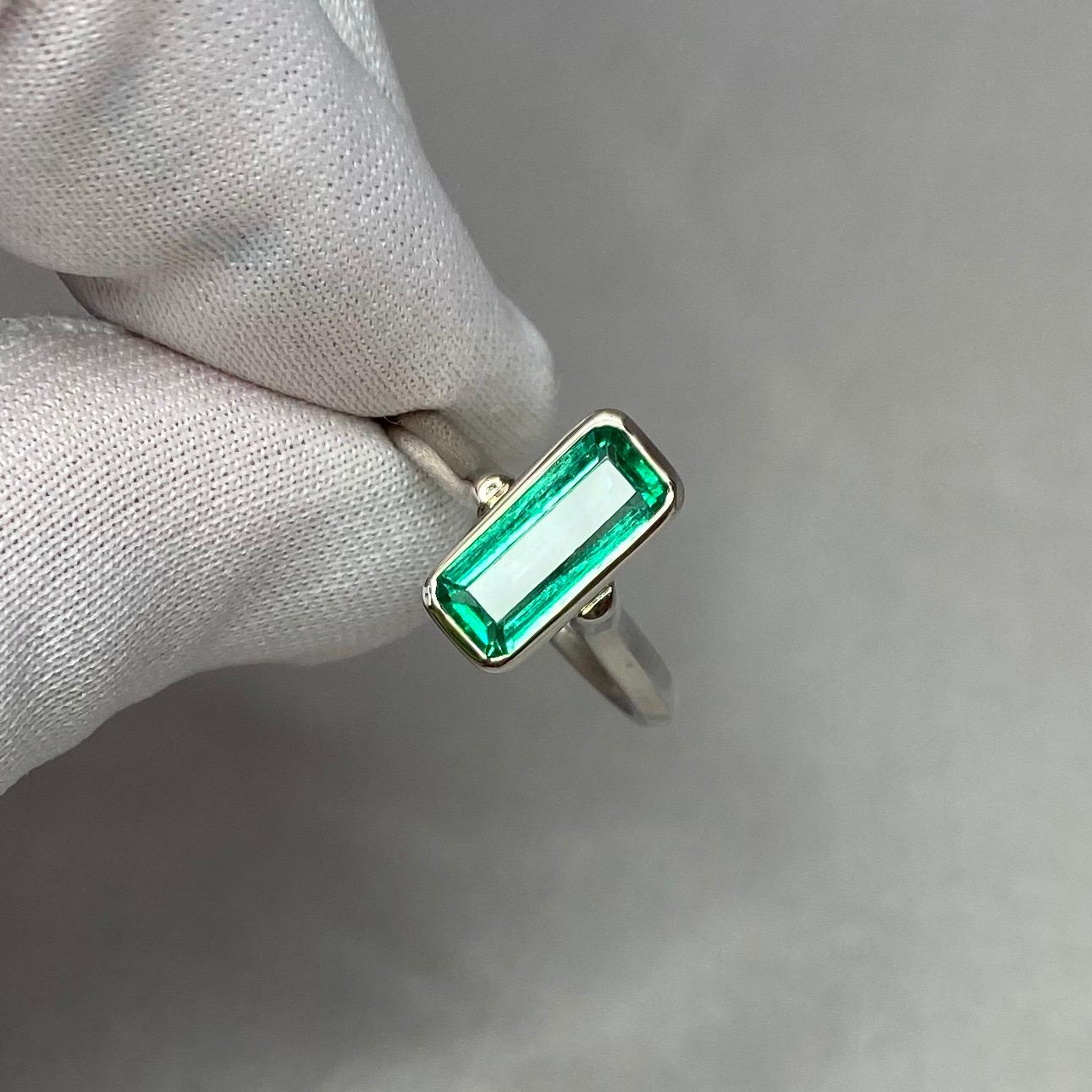 Fine Natural Vivid Green Colombian Emerald 18K White Gold Ring.

Stunning 1.76 carat stone with a fine vivid green colour. Top grade stone with exceptional clarity. Very clean stone, particularly by emerald standards.
The colour on this emerald is