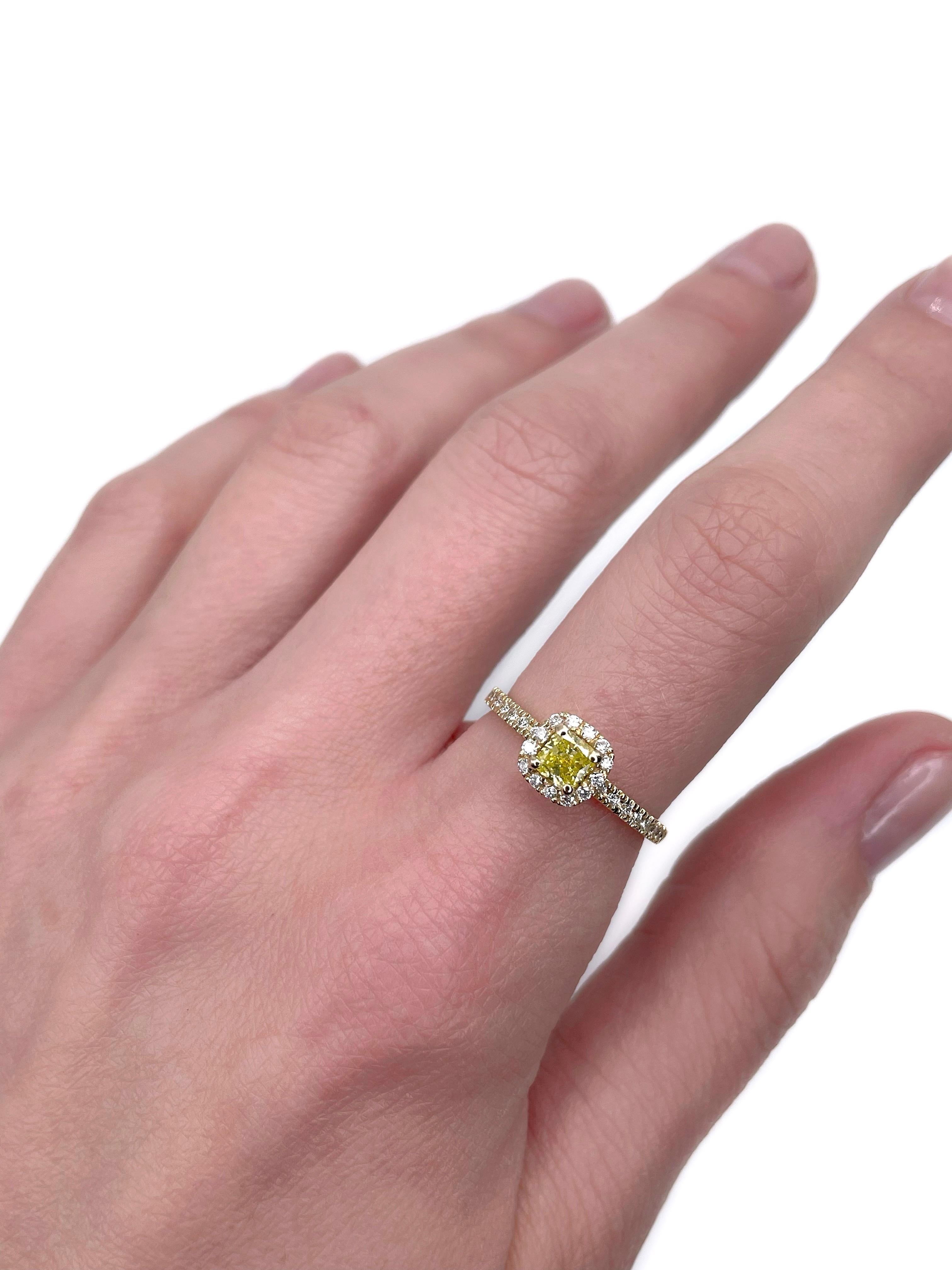 This is a modern engagement ring crafted in 18K yellow gold. The piece is certified by Gem Report Antwerp (can be found in photo gallery).

The ring features 0.40ct cushion brilliant cut natural fancy yellow diamond in the centre. It is accompanied