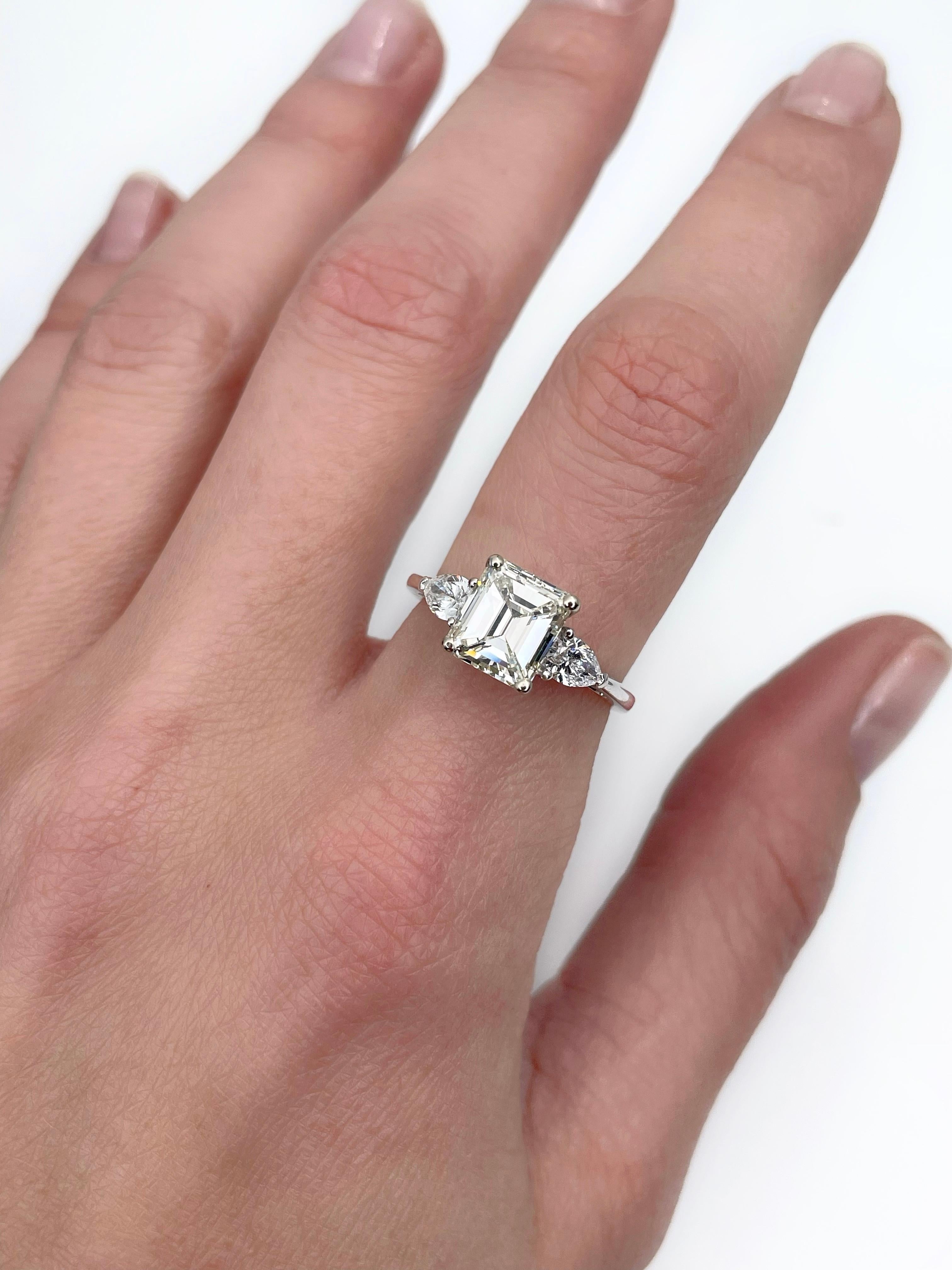 This is a magnificent engagement ring crafted in 18K white gold. It features 2.03ct central diamond and two pear shape diamonds (TW 0.42, G-H, SI). 

Circa 2020

The central diamond is certified by International Gemological Institute (can be found