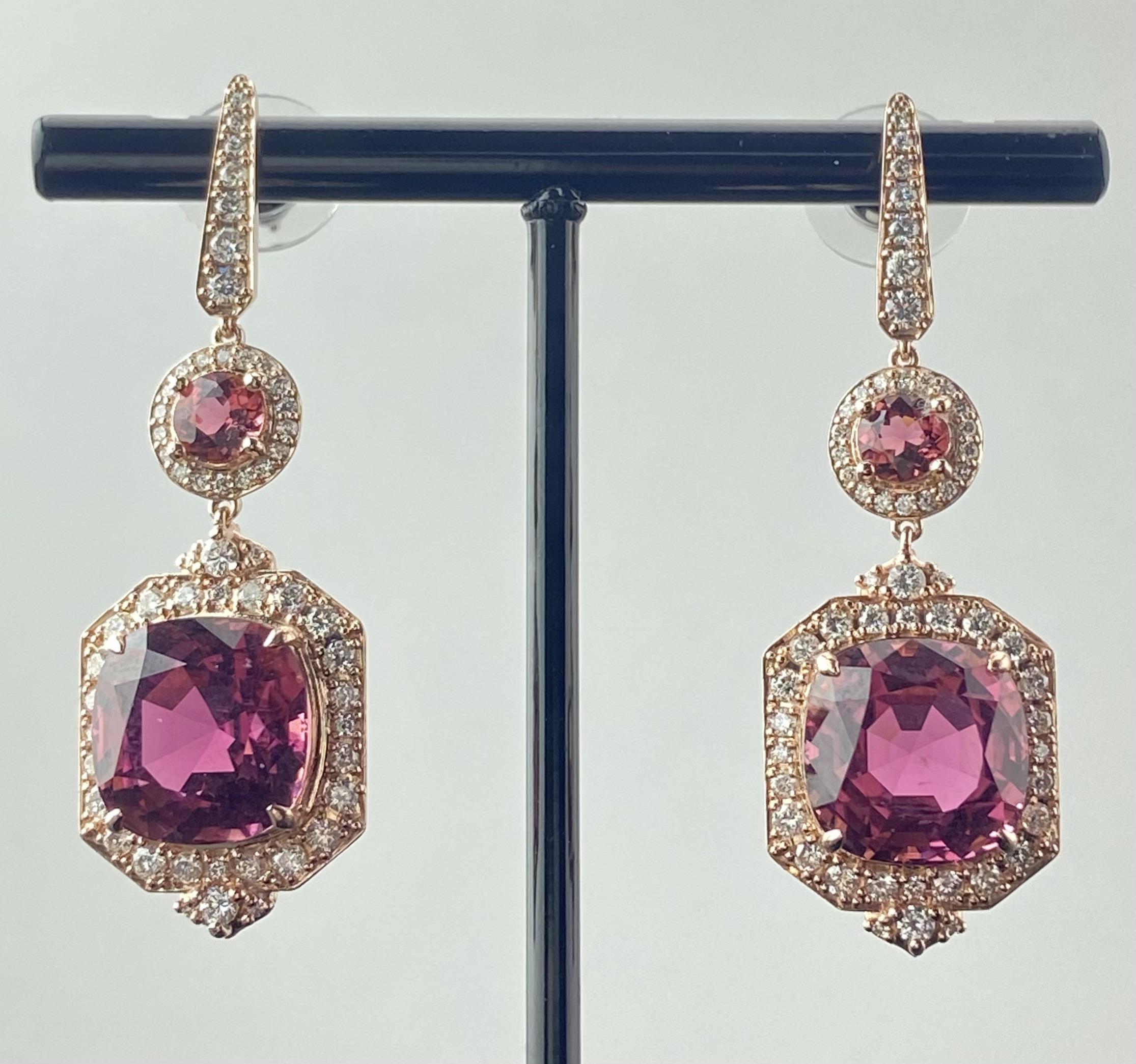 Experience the allure of these cushion shaped earrings, adorned with 18.06 carats of Pink Tourmaline and Diamonds. The gold setting, embellished with diamonds make this piece a show stopper. Beyond their beauty, Pink Tourmaline, known for its