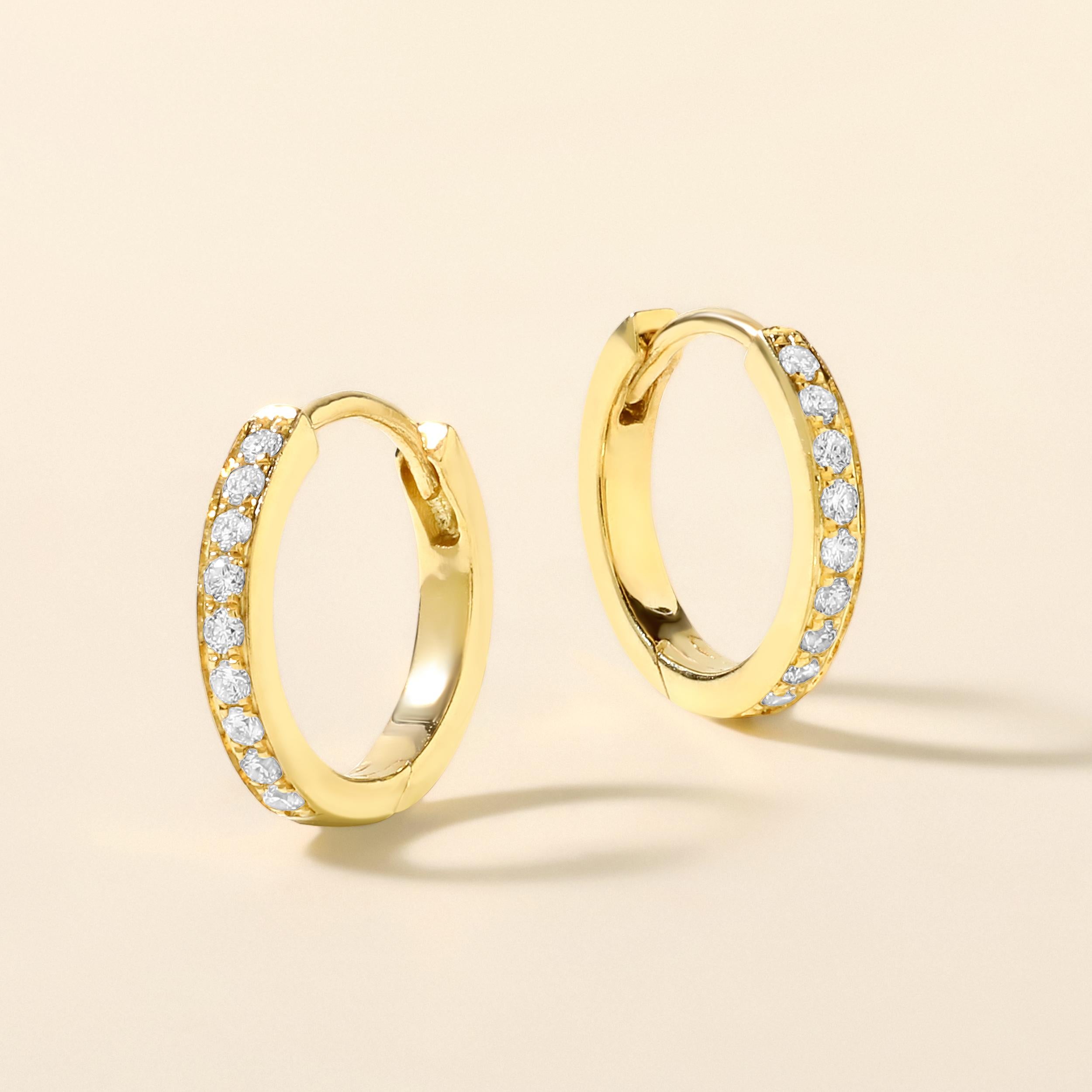 Crafted in 1.53 grams of 18K Yellow Gold, the earrings contains 18 stones of Round Diamonds with a total of 0.09 carat in E-F color and VVS clarity.

This jewelry piece will be expertly crafted by our skilled artisans upon order. Allow us a shipping