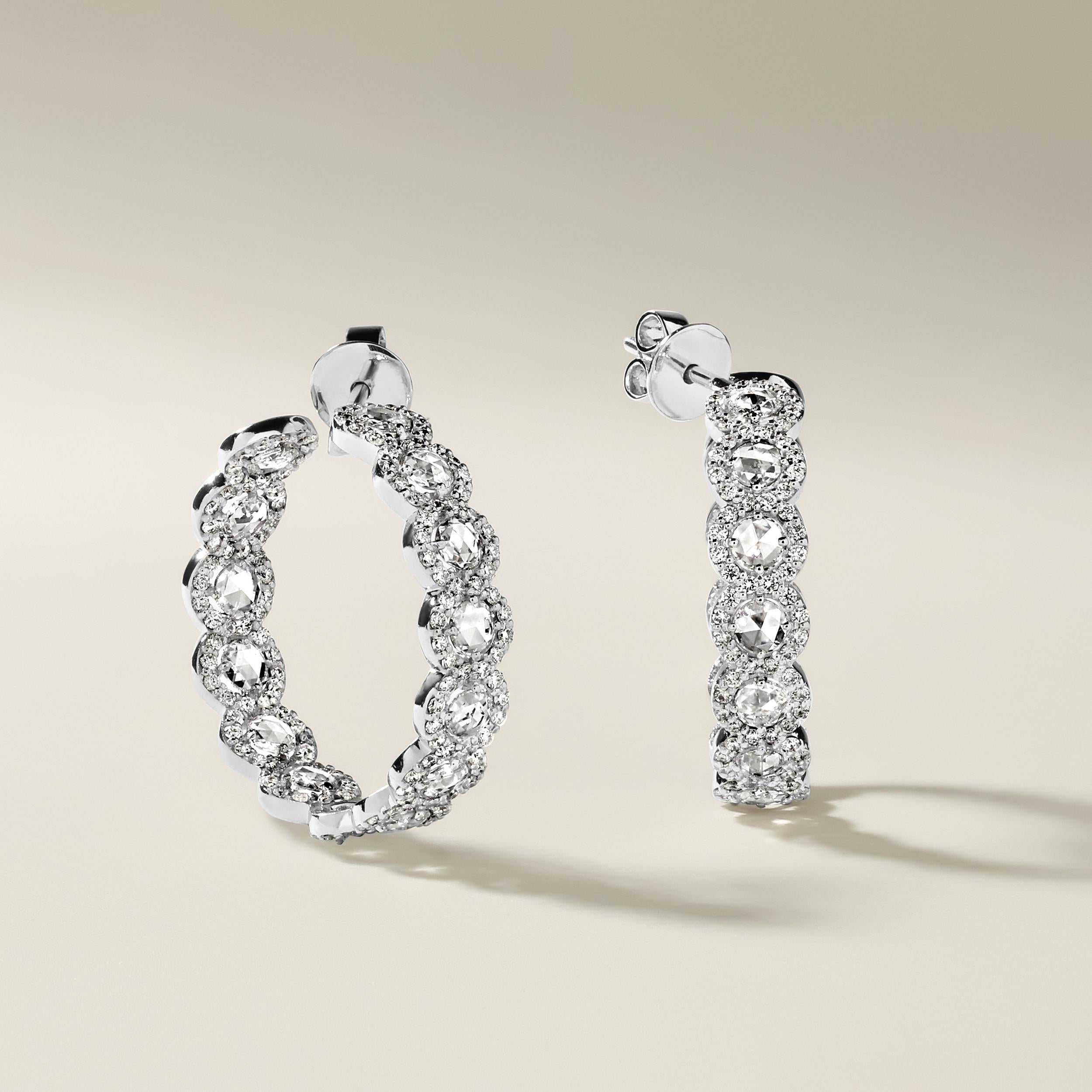 Crafted in 12.13 grams of 18K White Gold, the earrings contain 28 stones of Rose Cut Natural Diamonds with a total of 2.22 carat in E-F color and VVS-VS clarity combined with 290 stones of Round Natural Diamonds with a total of 1.71 carat in E-F