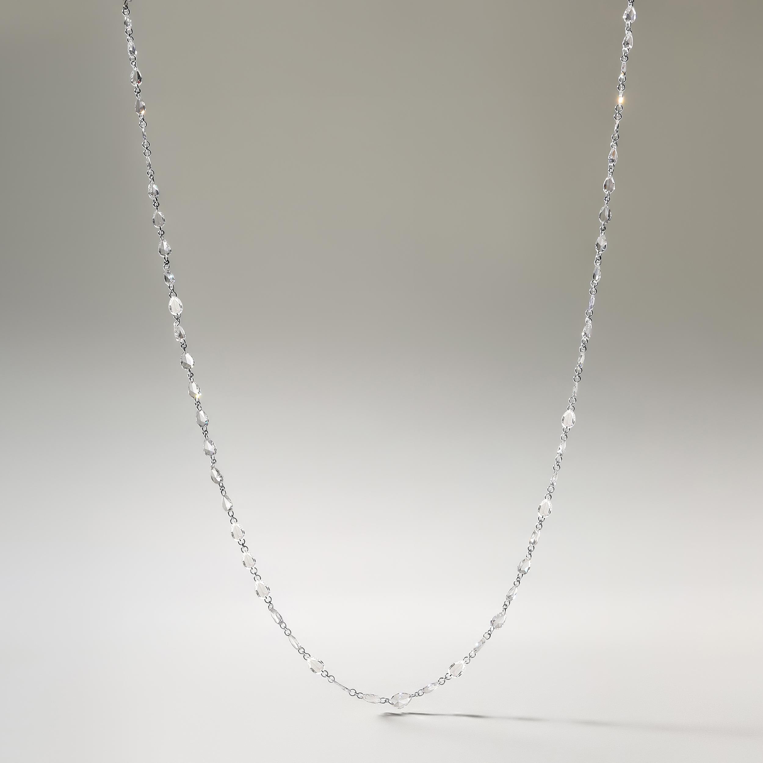 Crafted in 2.55 grams of 18K White Gold, the necklace contains 70 stones of Pear Shaped Rose Cut Natural Natural Diamonds with a total of 5.64 carat in E-F color and VVS-VS clarity. The necklace length is 18 inches.

CONTEMPORARY AND TIMELESS