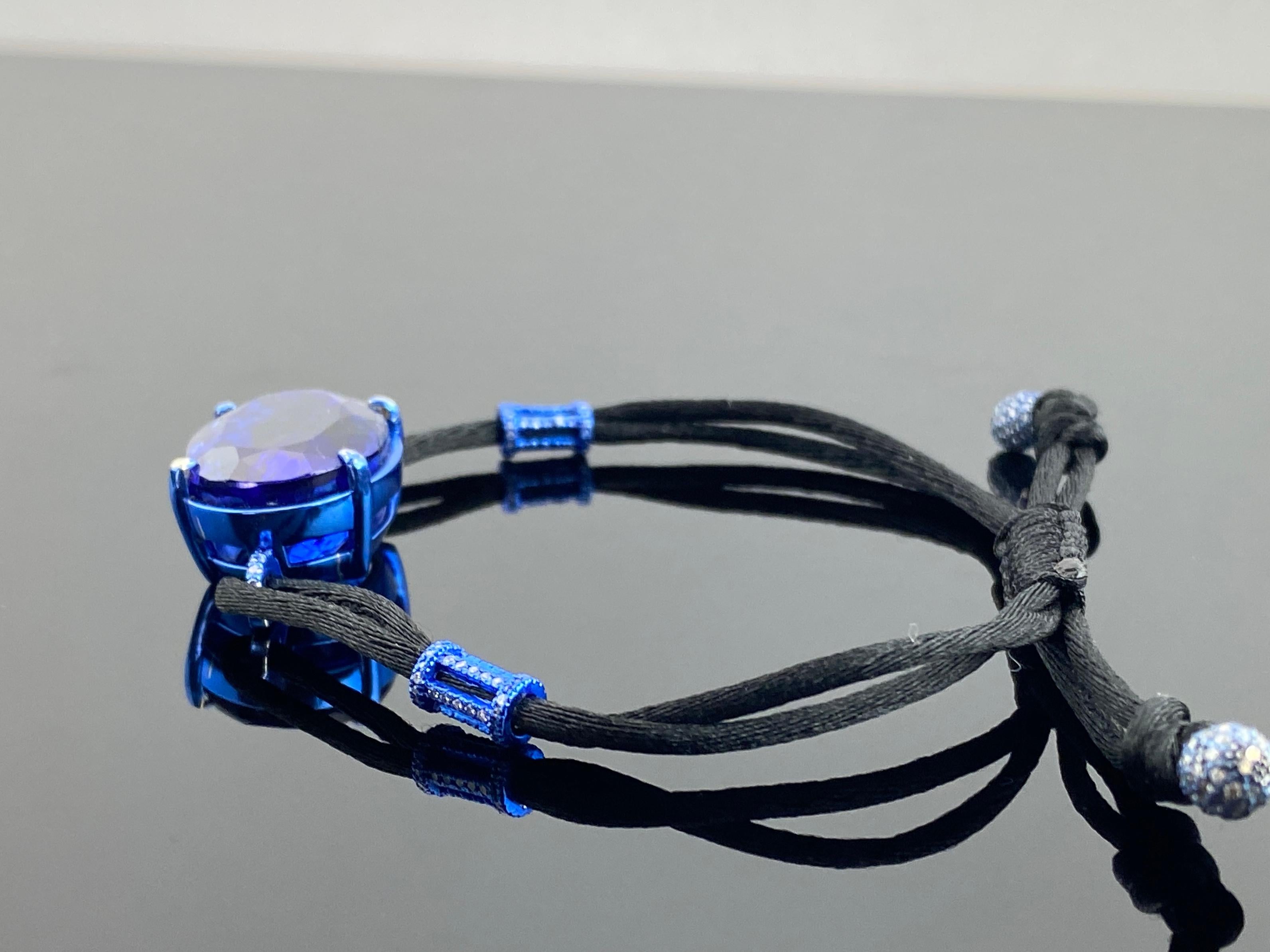The bracelet features a vivid blue colored tanzanite set in 9.67 grams of 18K white gold which has been carefully plated blue to match the hue of the tanzanite . The tanzanite weighs an impressive 29.5 carats, along with 242 pieces of VS diamonds (