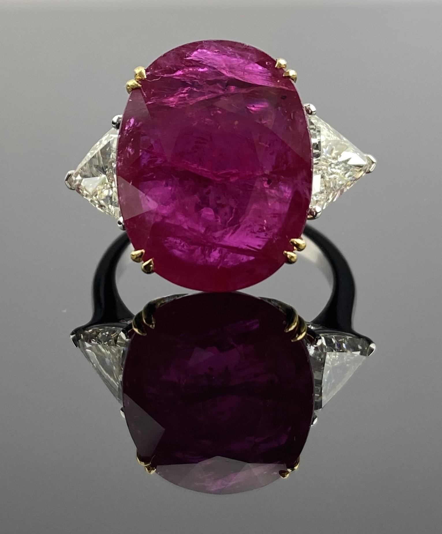 Make a bold statement with this 18K white gold ring, featuring a breath taking oval-cut ruby that commands attention with its rare size and vibrant red colour. Measuring an impressive 13.5 x 17 mm and weighing 12.40 carats, this ruby is a