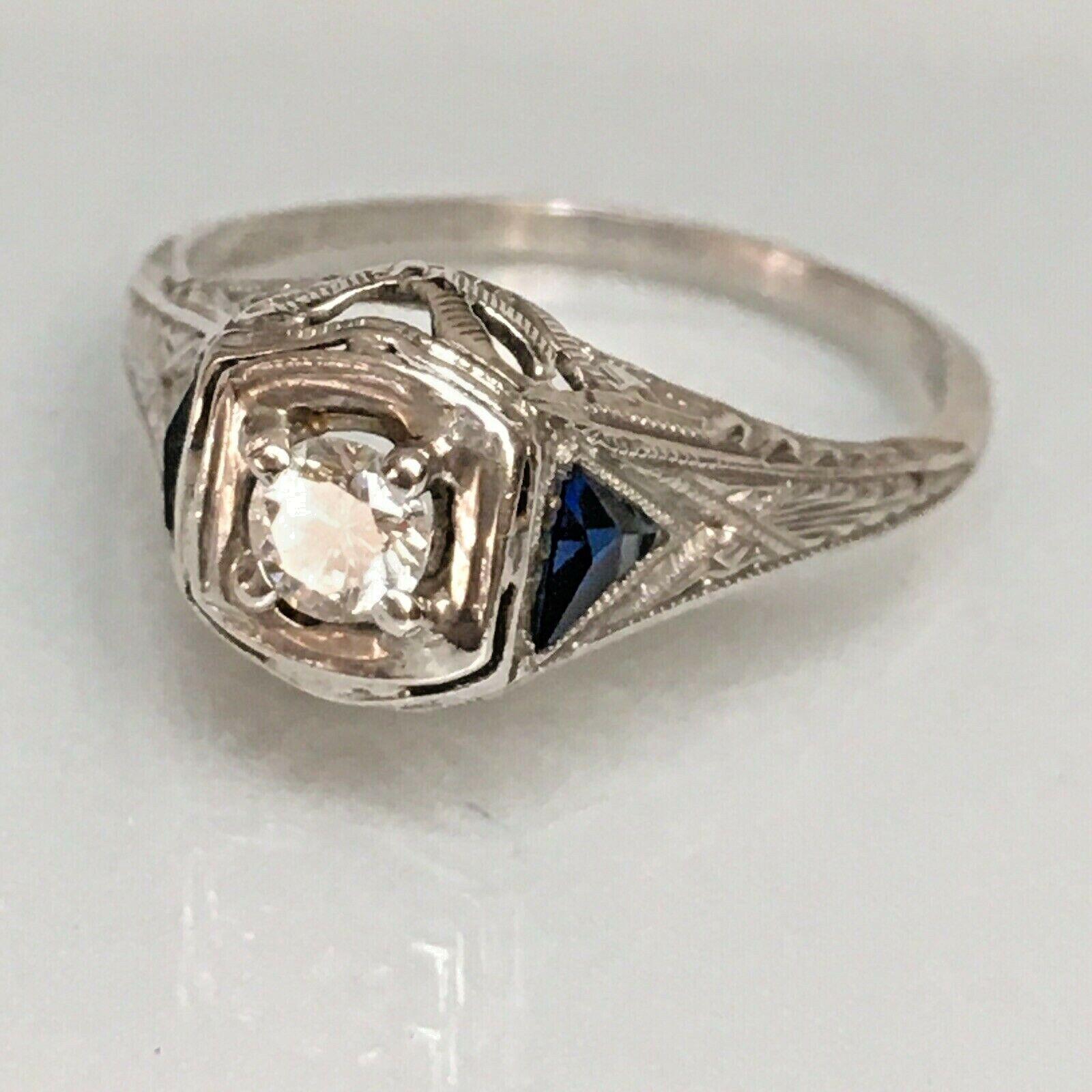 Certified 1920s Artdeco Platinum 1/6 Carat Diamond Sapphire Ring American
Filigree Work
Finger Size 4.75
Certified
In excellent condition considering the age, certified, see pictures

Authentic American Antique 100 Yrs old
Art Deco Platinum Diamond