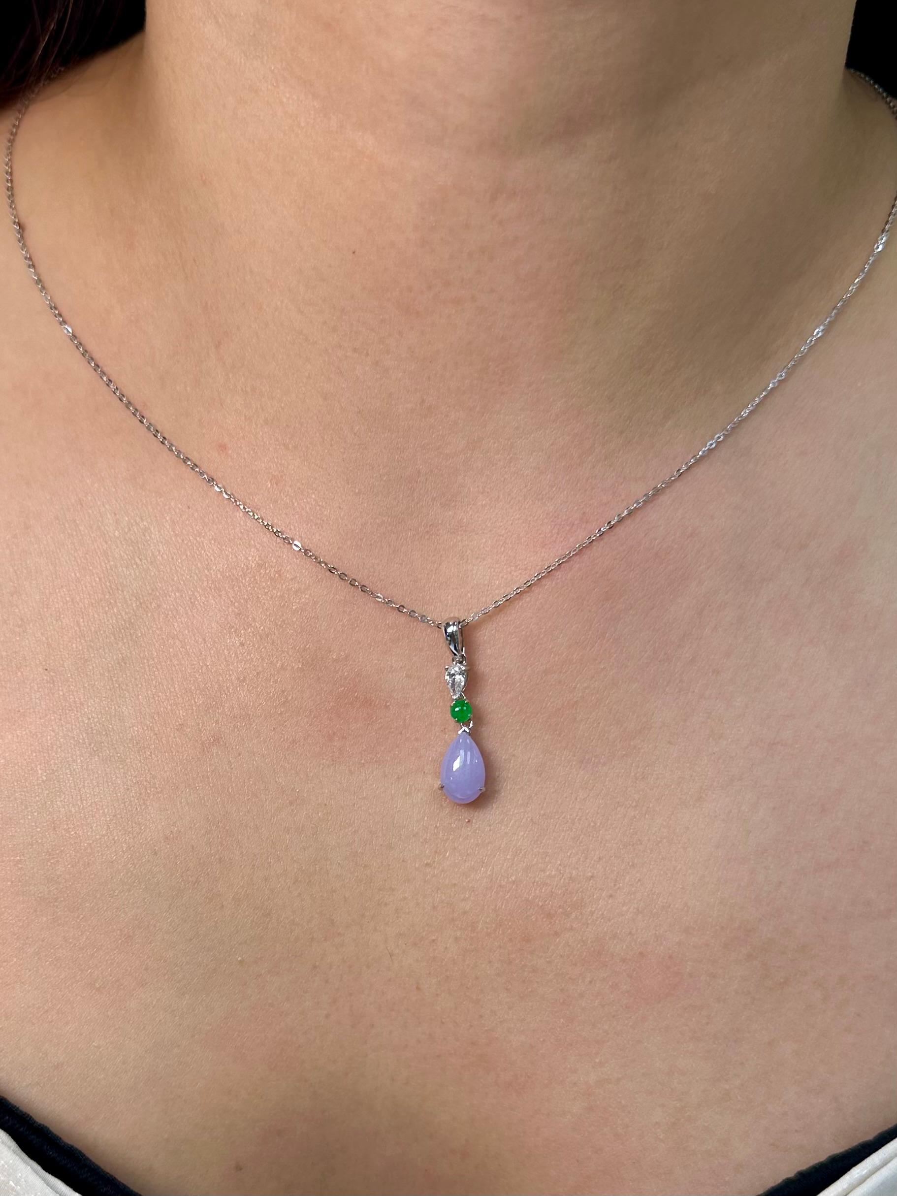 Please check out the HD video! The Jade is certified to be natural. The pendant is set in 18k white gold with one pear cut diamond. The diamond weights 0.15 cts. The untreated / un-enhanced natural lavender jade is translucent. The color is a