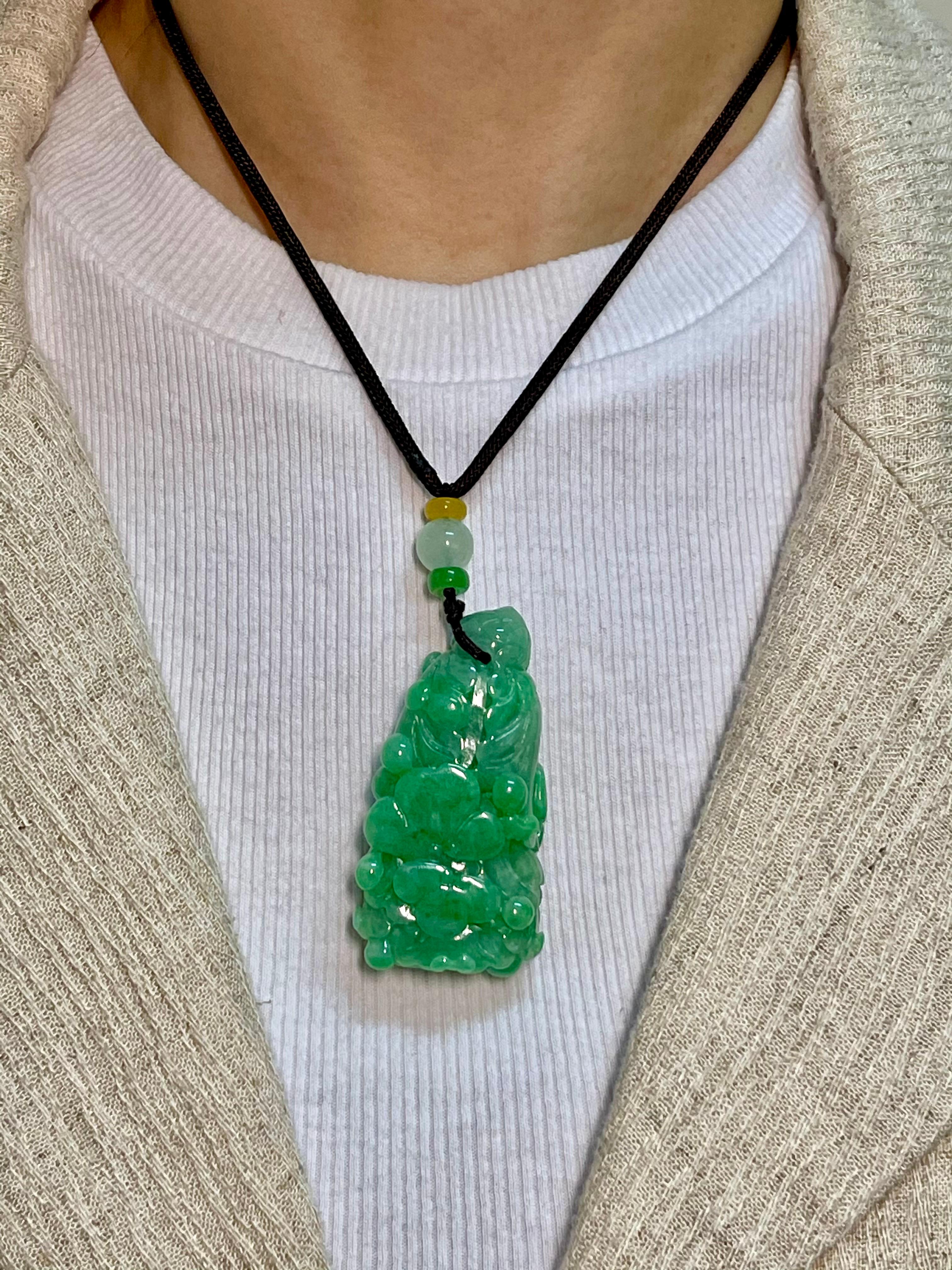 Please check out the HD video. This is certified natural jadeite jade by two labs. The jade flower is paired with some color beads for contrast. Flower carvings symbolizes enlightenment and open mindedness. This pendant is substantial at almost