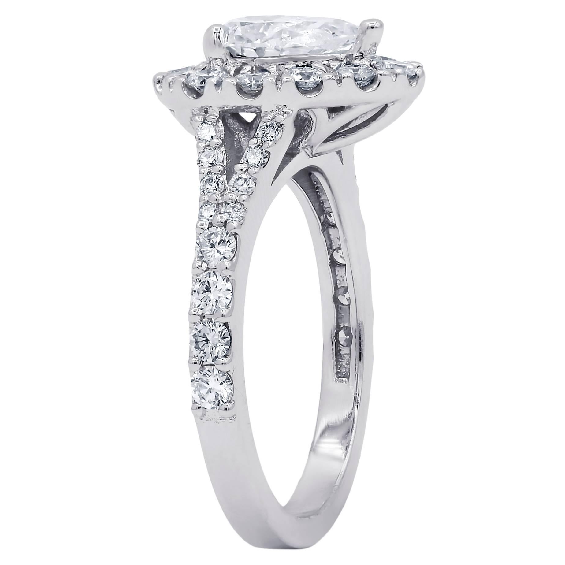 Certified 18 karat white gold diamond engagement ring features natural 1.15 carat pear cut diamond in the center and accented by 0.82 cts round cut diamonds on the side and set in custom made halo mounting. 

• Style- Halo Ring                      