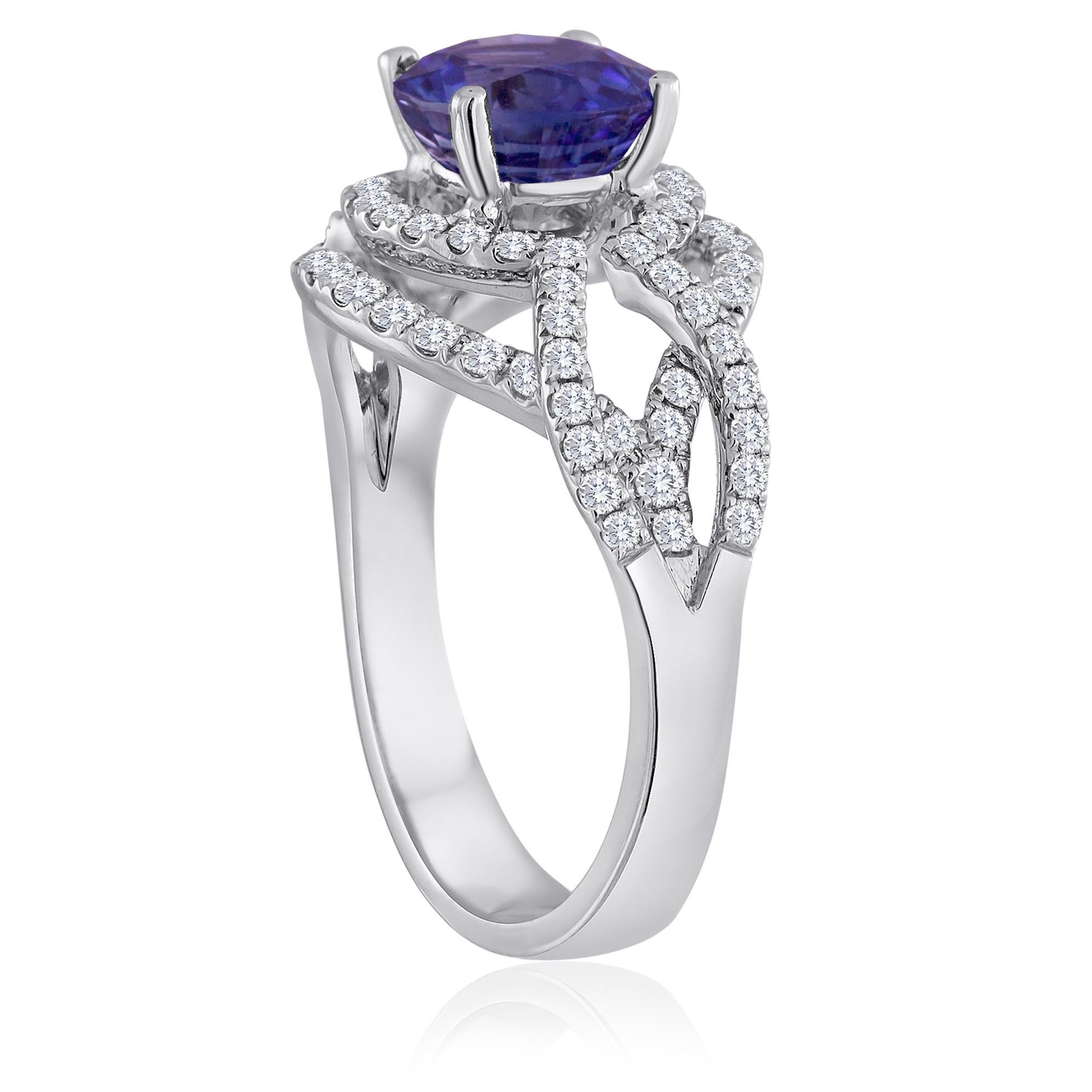 Beautiful Double Halo Ring.
The ring is 18K White Gold.
The center stone is a round 2.01 Carat Blue Sapphire.
The Sapphire is heated and is certified by LAPIS.
There are 0.84 carats in diamonds F/G VS.
The ring is a size 6.5, sizable.
The ring