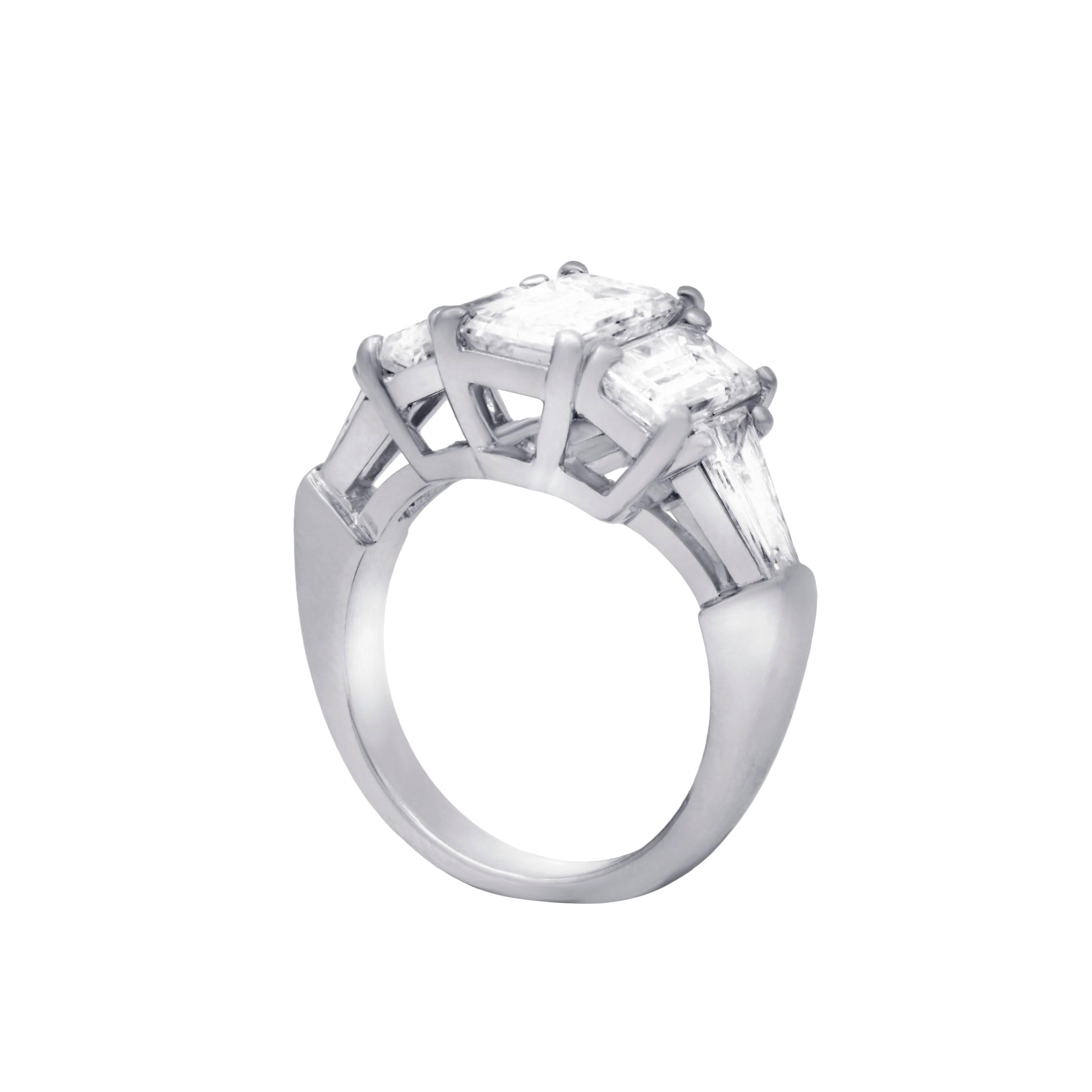 Platinum diamond engagement ring with  three certified emerald cut stones.The center EGL certified emerald cut features 2.03 cts J/VS1.
Side GIA certified diamonds features 1.01 ct I/VS1 and 1.00ct I/VS1.
Shank is adorned with additional two