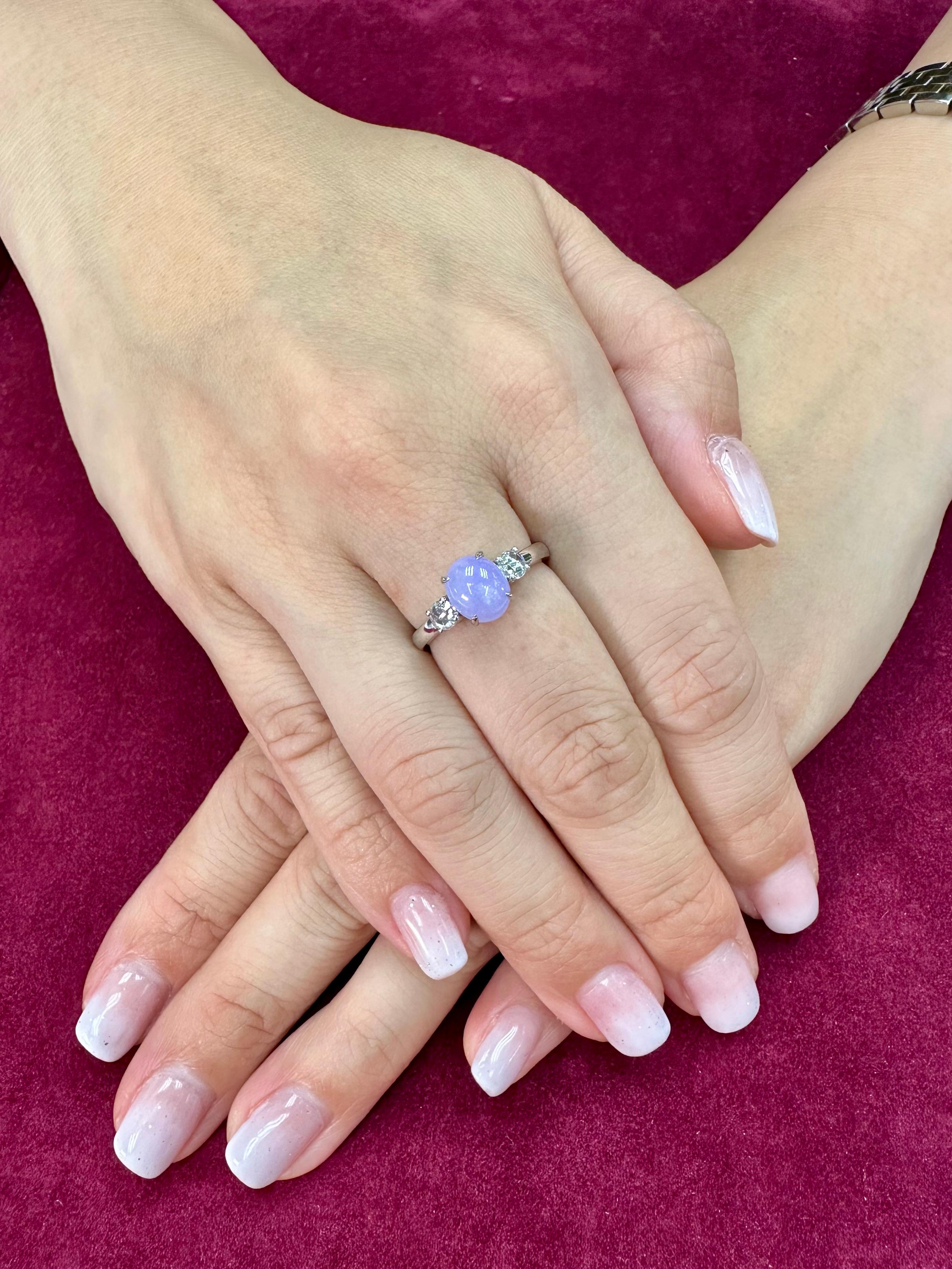 Please check out the HD Video! Here is a very eye pleasing lavender jade and diamond 3 stone ring! It is certified natural jadeite jade. The ring is set in 18k white gold and diamonds. There are 2 new rose cut diamonds that are on each side of the