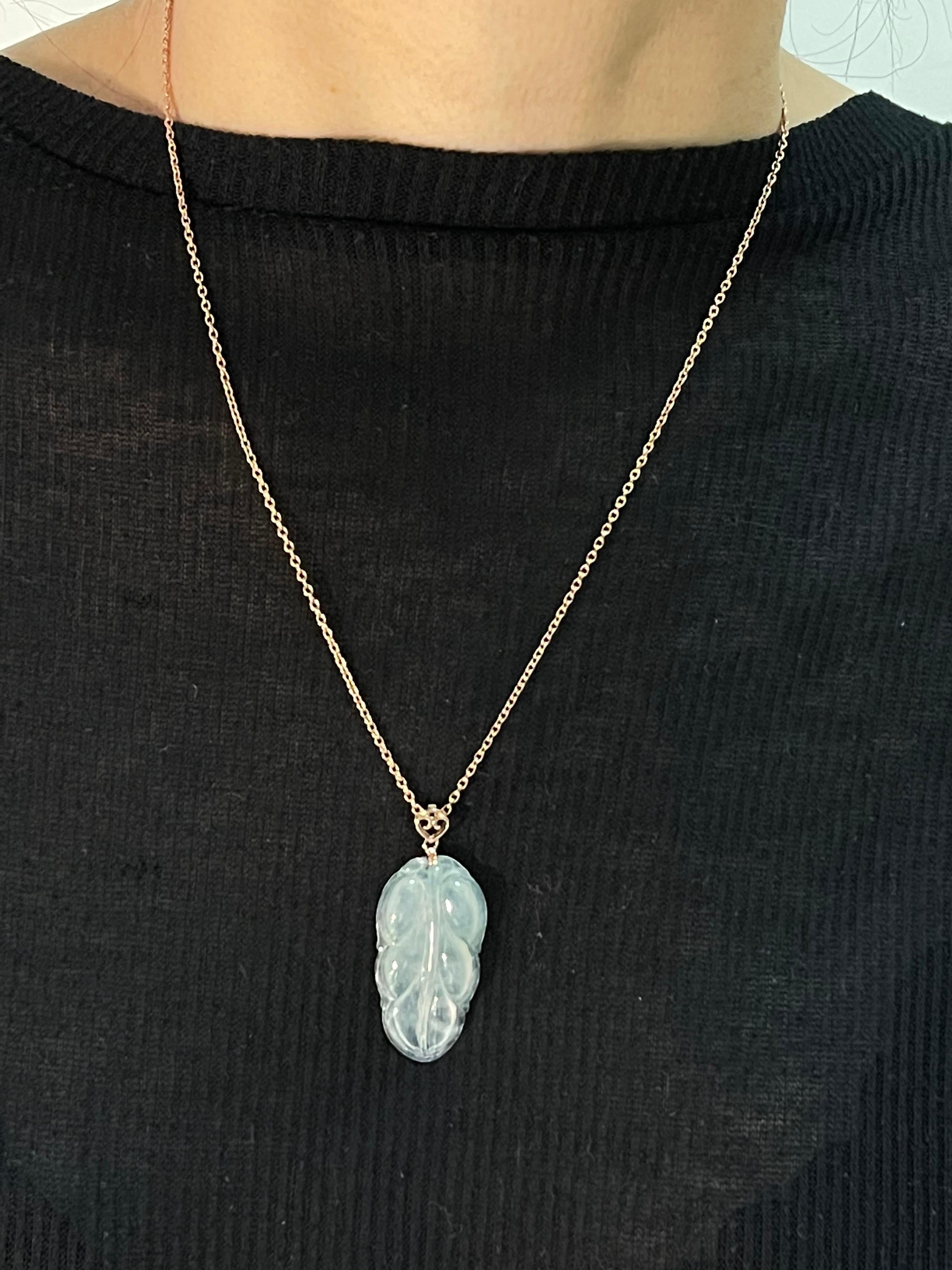 Please check out the HD video! This pendant is certified by two labs to be natural jadeite jade. The pendant is set in 18k rose gold. Clean and colorless jades are well liked. The meaning behind the jade leaf carving is that the wearer will receive
